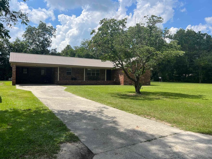 This 4 bedroom 2 bath traditional home is ready for a big or growing family. Great neighborhood in the city limits are a plus. The home comes with a double lot so you have a huge outdoor space. Come take a look and make this one "The One" for your family by adding your own taste and style. This one will not last long so call Michelle to schedule a showing. 912-213-0316