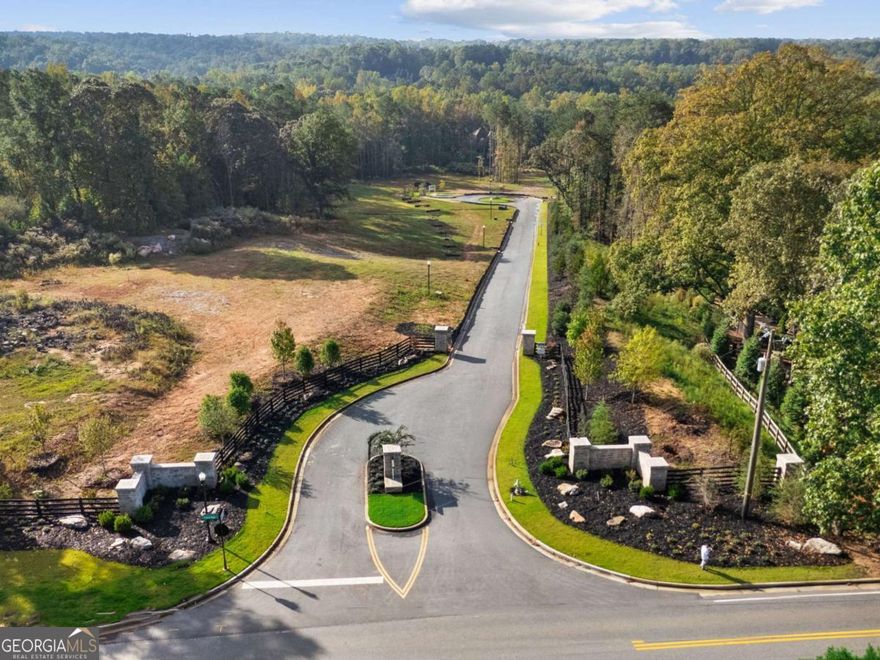 Welcome to Brooke Hall, a prestigious gated enclave in the heart of Milton. This exclusive seven-lot community, featuring all walk-out lots, offers a rare opportunity to build your dream home on a spacious 1+ acre homesite. Designed for privacy, comfort, and effortless everyday living, each property provides the perfect setting for walk-out main-level living in a serene, tree-lined environment. Here, you can create a home that truly reflects your lifestyle-whether that means a main-level primary suite, open-concept living spaces, or expansive glass doors that open directly to your backyard oasis. Every homesite is designed to make indoor-outdoor living seamless, allowing you to entertain, relax, and connect with nature. In collaboration with Harrison Design and Frank Betz & Associates, you can choose from thoughtfully crafted plans that blend timeless architecture with modern functionality, bringing together elegant craftsmanship and livable luxury. Paces Ferry Builders, or one of their approved partners, serves as the exclusive builder for this community. Set in one of North Atlanta's most desirable locations, Brooke Hall captures everything people love about Milton-rolling pastures, equestrian estates, and open skies-paired with easy access to top-rated schools, boutique shopping, and farm-to-table dining. Just minutes from beloved local favorites such as Milton's Cuisine & Cocktails, The Union, Bloom Roadside, and the charm of both Downtown Milton and Downtown Alpharetta, Brooke Hall offers a lifestyle that's both peaceful and connected. This is more than a neighborhood-it's a place where walk-out main-level living meets timeless design, in one of Georgia's most beautiful and sought-after communities.