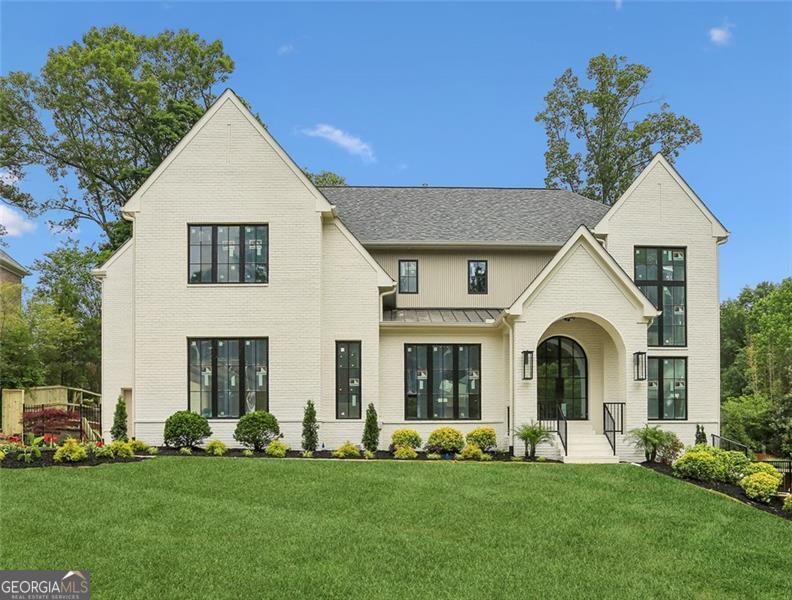 Welcome to this stunning custom home, meticulously crafted by White Oak Home Builders. Every inch of this 6-bedroom, 5.5-bath residence reflects timeless craftsmanship and refined luxury, seamlessly blending high-end design with everyday comfort. Step inside to find white oak flooring and finishes throughout, setting the tone for the home's cohesive, organic elegance. The expansive chef's kitchen is a showpiece, featuring custom cabinetry, paneled Sub-Zero refrigerators, a Wolf range, and a full Visual Comfort chandelier and pendant lighting package that elevates every space. Casement windows fill the home with natural light, highlighting the thoughtful details and premium materials at every turn. Spa-like bathrooms boast luxury plumbing fixtures and bespoke cabinetry, creating serene retreats throughout. Outside, the Pebble Tec pool and spa offer a private oasis with full automation, perfect for effortless entertaining. The professional landscaping is both beautiful and functional, enhanced by a fully automatic irrigation system, elegant gas lanterns, and landscape lighting that adds nighttime allure. From the striking curb appeal to the sophisticated interiors, this home is a rare opportunity to own a one-of-a-kind property built to the highest standard.