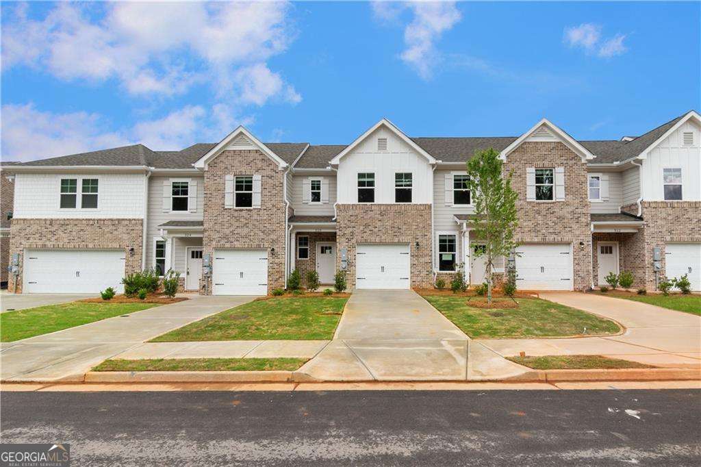 Welcome to Avery Landing by DRB Homes - your new home in the highly sought-after McDonough area! This beautifully crafted single-family townhome combines style and functionality, with no detail overlooked. The spacious Braden floor plan offers 3 bedrooms, 2.5 bathrooms, and an open-concept main level perfect for modern living and entertaining. The gourmet kitchen is a true showstopper, featuring a large island with quartz countertops, stylish painted cabinetry, and a generous pantry for storage. Upstairs, the inviting owner's suite includes a sizable walk-in closet, dual vanities, and a sleek tile shower. Enjoy the convenience of included stainless steel appliances-side-by-side refrigerator, range, microwave, dishwasher-plus a washer and dryer. Additional highlights include a one-car garage with opener and a private patio-ideal for outdoor relaxation. Avery Landing offers the perfect blend of comfort, design, and convenience. Schedule your tour today! Please note: If the buyer is represented by a broker/agent, DRB REQUIRES the buyer's broker/agent to be present during the initial meeting with DRB's sales personnel to ensure proper representation.