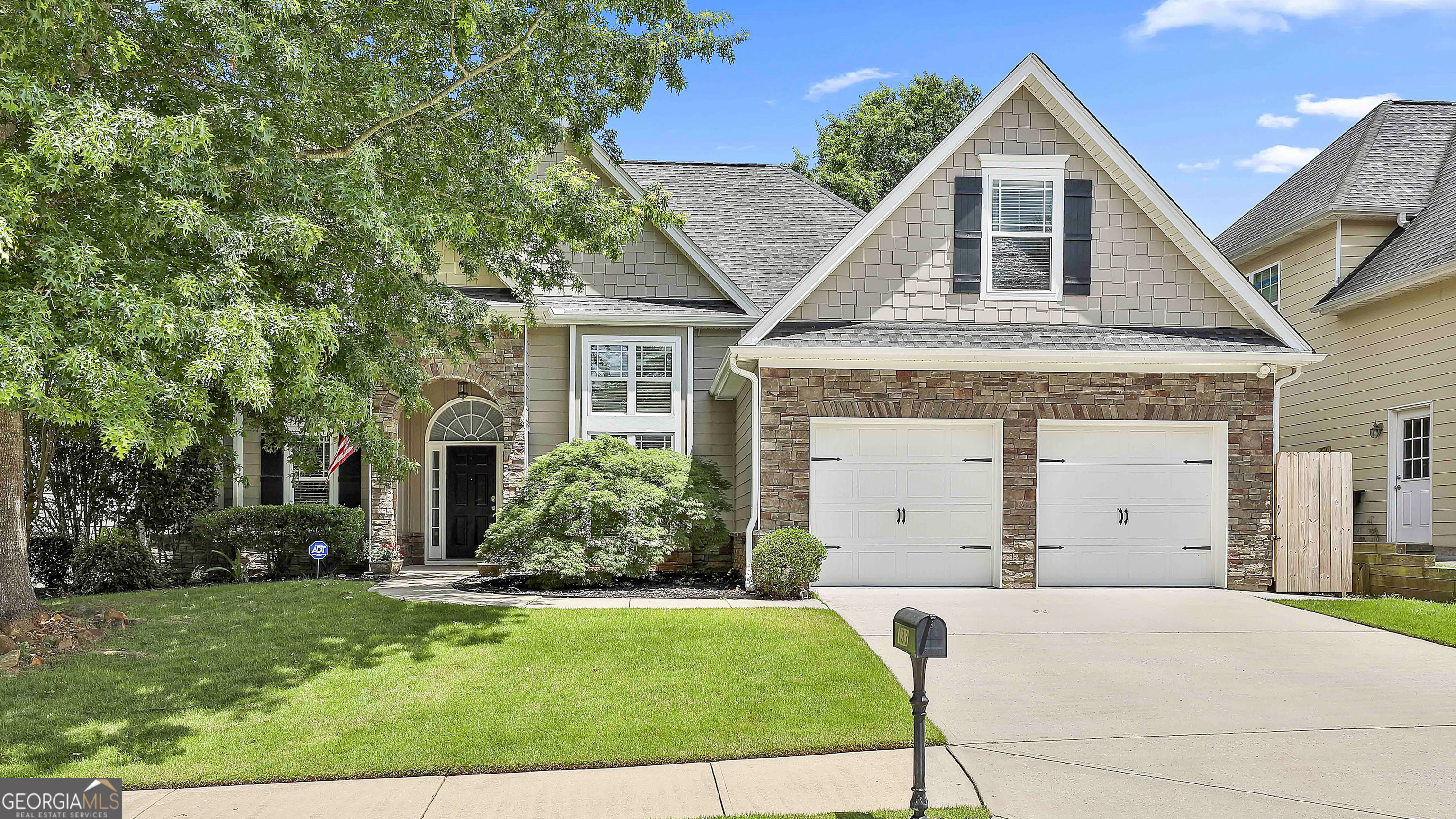 Welcome to this beautifully maintained 5-bedroom, 3-bathroom home located in Camden Village at Stillwood Farms. You'll be greeted by a charming covered stone archway entrance leading into a dramatic two-story foyer. Just off the foyer, you'll find a formal dining room featuring double-stacked windows that flood the space with natural light. The family room, anchored by a stone fireplace and enhanced with coffered ceilings, opens to the kitchen and casual dining area-perfect for both everyday living and entertaining. The kitchen is complete with granite countertops, stainless steel appliances, a breakfast bar, and ample cabinet storage. The oversized main-level primary suite offers tray ceilings and a cozy sitting room. The luxurious en suite bath includes double vanities, stand-up shower, soaking tub, and spacious walk-in closet. This split bedroom floorplan features two additional bedrooms and a full bathroom on the main floor, offering flexible space for guests, a home office, or multi-generational living. Upstairs, you'll find two oversized bedrooms and another full bathroom. Enjoy outdoor living year-round on the screened-in patio, overlooking a fenced backyard complete with a storage shed for added convenience. Community amenities include a swimming pool and playground, making this a perfect home for YOU! Southeast Mortgage is our preferred lender. If buyer chooses to work with them, Southeast Mortgage will provide 1% credit up to $5,000. Reach out to the listing agent for more information.