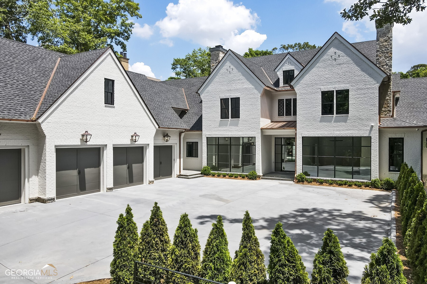 MOVE IN READY.. New Construction in exclusive Tuxedo Park. This unique home features 12' ceilings, over 5000 square feet on the first level with Owners Suite, additional Bedroom ensuite, and home office with fireplace. Multiple window walls throughout allows natural daylight to warm this home. Private rear yard includes a walkout heated saltwater 20x40 pool, hot tub with Pennsylvania Blue Stone pool deck. Open Pool House with grande vaulted ceiling post and beam room includes a bath, laundry and mudroom area. Be prepared to have all your desires satisfied as you enter this gated estate with security cameras for digital monitoring. Home shown by Appointment Only.