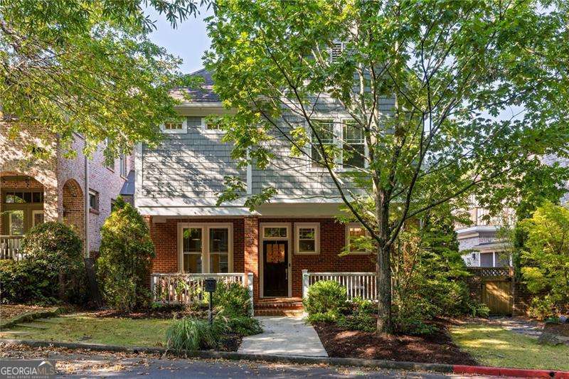 Set on one of Lake Claire's most charming streets, this Sutherland Place home is an everyday escape where style, comfort, and effortless living meet. The main level welcomes gatherings with a bright open kitchen that flows into dining and living spaces, anchored by a gas fireplace - perfect for weekend brunches, cozy movie nights, or casual evenings with friends. Step outside to your private courtyard designed for summer grilling, al fresco dinners, and long nights under twinkling lights. A flexible space on the main level provides room for a dedicated office, library, or quiet sitting area. Upstairs, the oversized primary suite is a true retreat. Curl up with a book in the sitting area, decompress in the spa-like bath with dual vanities, soaking tub, and tiled shower, then step into an expansive walk-in closet where every outfit has its perfect place. Two additional bedrooms with en-suite baths offer comfort and flexibility for guests, a home gym, or a creative studio. A dedicated laundry room with a utility sink and ample storage makes weekly chores simple. Fresh paint, designer lighting, and clean modern finishes create a polished backdrop throughout, while a two-car garage and community-maintained grounds make life effortless. Zoned for Mary Lin Elementary, enjoy easy strolls to Lake Claire Park, Lake Claire pool, the PATH, and Pullman Yards. Picture morning coffee on the porch, sunset drinks in the courtyard, weekend gatherings with friends, and quiet nights in your private suite.