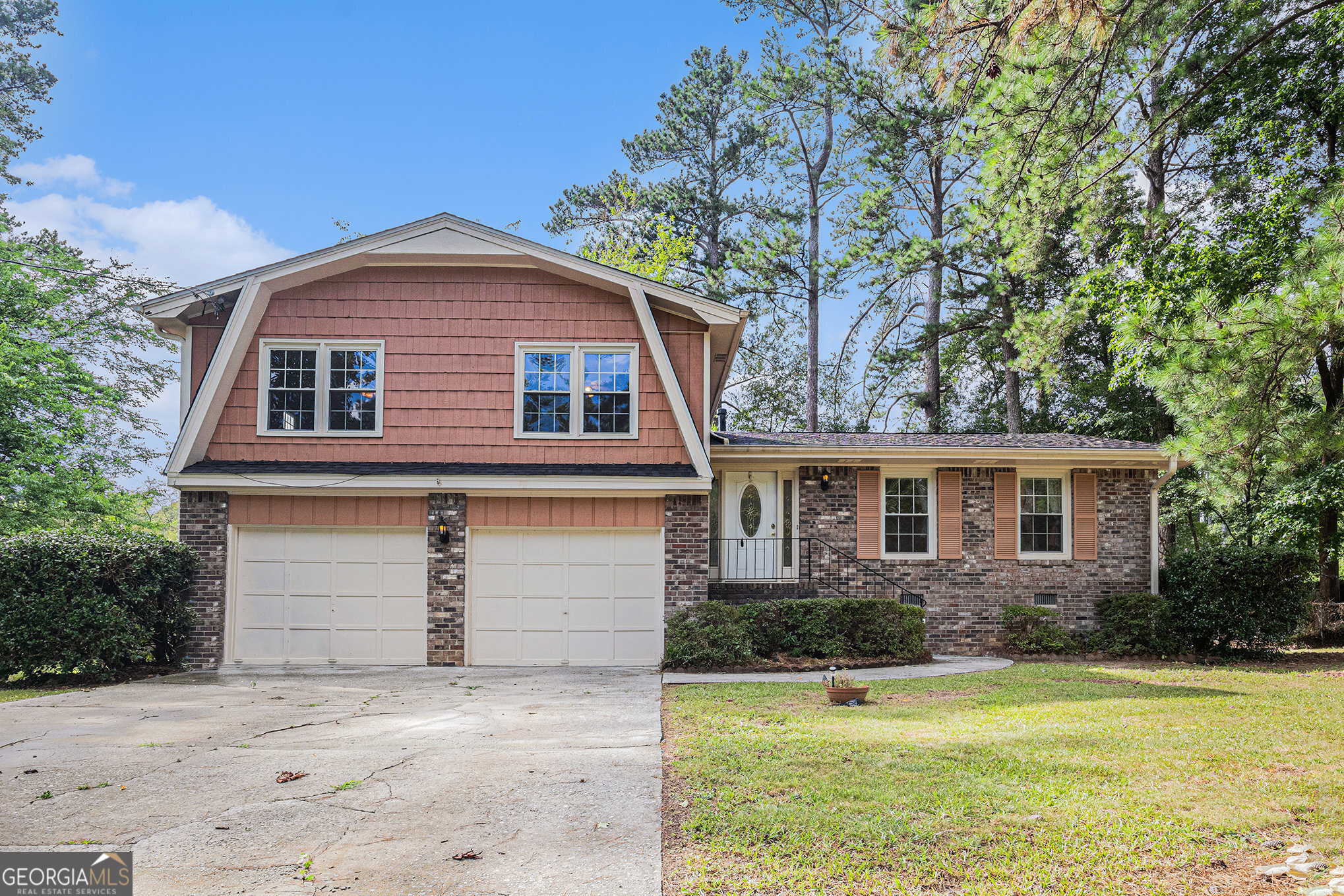 Opportunity Awaits in the Mountain Park/Trickum/Parkview School Area! This 3-bedroom, 2-bath split-level home is full of potential and nestled on a quiet street with no HOA. Featuring a classic 4-side brick and siding exterior, this home offers a spacious backyard, patio area, and a basketball goal setup - perfect for outdoor enjoyment. Inside, the home retains its original charm with no carpet in sight and is ready for your personal updates and vision. A great chance to customize a solid home in a sought-after location!