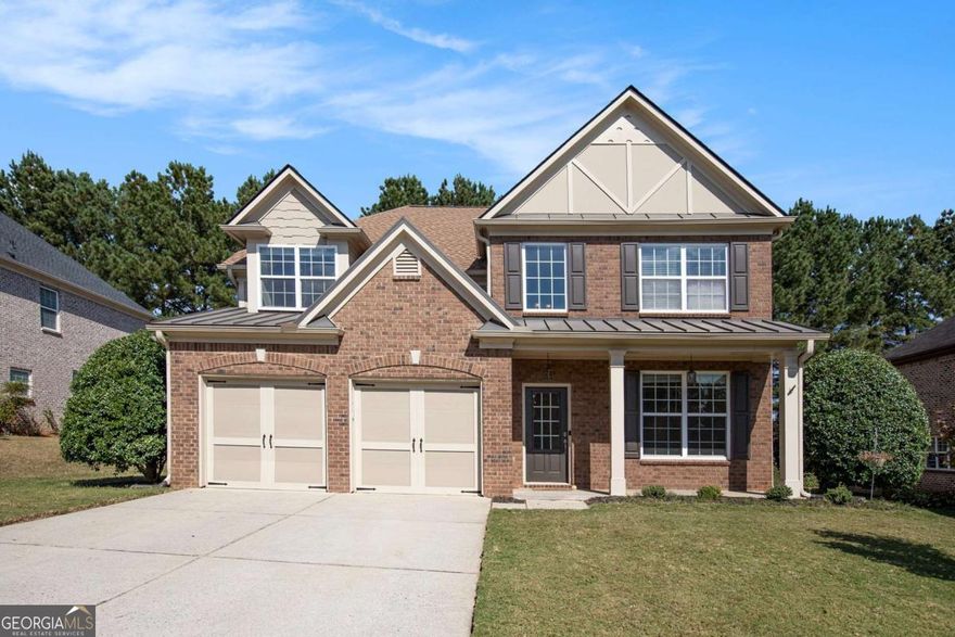 Welcome home to this beautiful three-sided brick residence offering timeless charm and modern comfort! Step inside to a spacious family room featuring a cozy fireplace, perfect for gathering with family and friends. A separate dining room provides an elegant space for hosting dinners and celebrations. The bright and inviting eat-in kitchen boasts solid surface countertops, a center island, pantry, and sleek stainless-steel appliances-ideal for both everyday living and entertaining. The serene primary suite is a true retreat with a large walk-in closet and a luxurious ensuite bathroom complete with dual vanities, a soaking tub, and a separate shower. A versatile bonus room offers the perfect space for a home office, playroom, or media area. Enjoy relaxing mornings on the charming front porch or unwind on the back patio overlooking the yard. With a two-car garage and exceptional curb appeal, this home perfectly blends classic style and comfort for today's lifestyle.