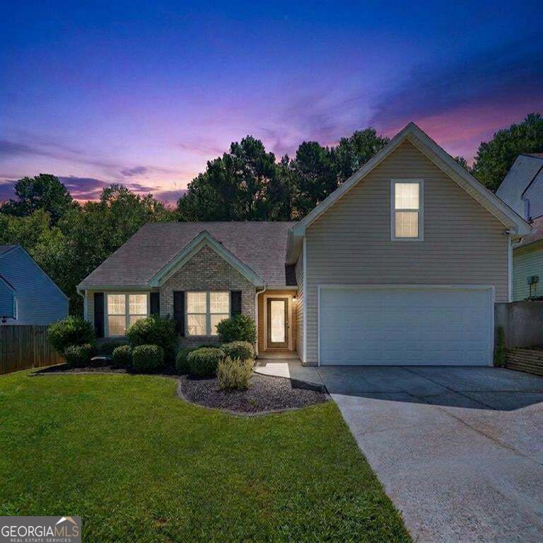 Photo of 1077 Woodsong Pass Ct, Lawrenceville, GA 30043 (MLS # 10876749)