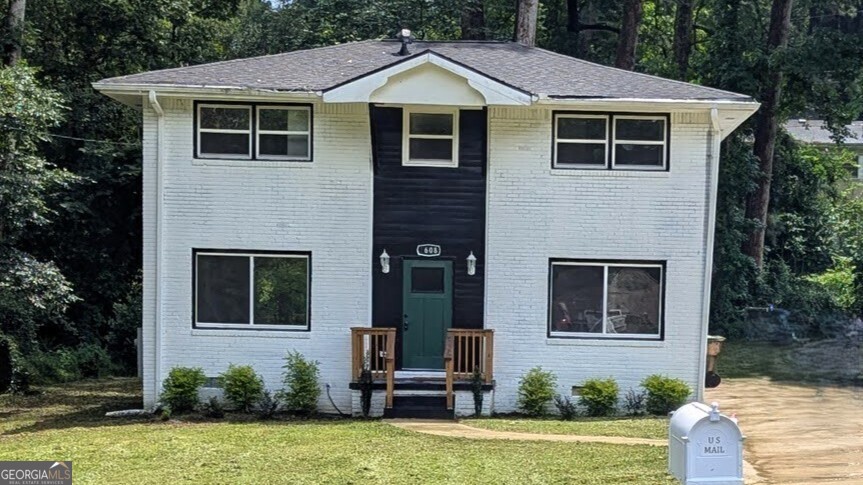 Large brick contemporary style home with spacious great room! Includes updated kitchen and renovated bathrooms with tile showers. Enjoy the large deck that overlooks the relaxing back yard. This charming single-family home is nestled in a vibrant and welcoming neighborhood with easy access to shops, restaurants, the airport, and major highways for convenient commuting. Experience the perfect blend of style, comfort, and East Atlanta location! Schedule a viewing today and make this gem your own!