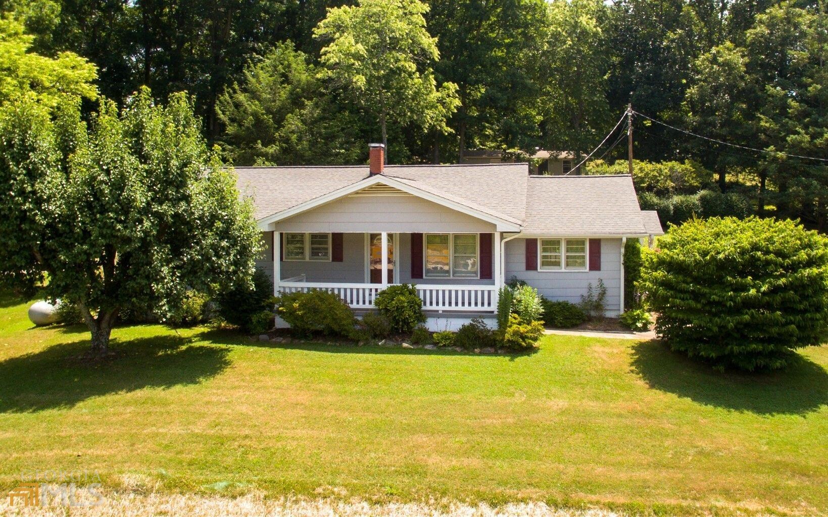 1.5+ ACRES ON HIGHWAY 69 PLUS 2 HOMES, LOCATED BETWEEN HAYESVILLE, NC & YOUNG HARRIS/HIAWASSEE, GA! This property offers substantial highway frontage, 1 updated home with 3 bedrooms, 2 bathrooms living room, office, large kitchen, front porch, unfinished basement perfect for your personalized expansion and a 2 car carport PLUS a 2nd home with 1 bedroom, 1 bathroom, a spacious kitchen, living room and laundry room. A great investment in our area with 2 acres on Hwy 69 and 2 homes.