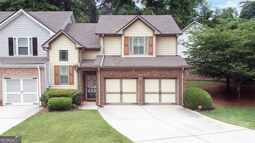 Welcome to this lovely 3-bedroom, 2.5-bathroom end-unit townhome nestled in the highly sought-after gated community of Brownstone Square. Enjoy the perfect blend of comfort and convenience just minutes from the charm of Historic Marietta Square-home to vibrant dining, shopping, entertainment, and seasonal festivals. This rare gem features a hard-to-find primary suite on the main level, complemented by gleaming hardwood floors throughout the main. Plantation shutters add classic elegance, while the open-concept layout offers both style and functionality. Upstairs, you'll find two generously sized bedrooms plus a large finished loft-ideal for a home office, playroom, or additional living space. The kitchen is equipped with sleek black stainless appliances, including a new dishwasher and stove (2024)-a stylish and practical touch for the home chef. Step outside to your private patio backing up to a peaceful wooded area-perfect for grilling, morning coffee, or evening relaxation. And when summer heats up, cool off in the neighborhood pool just steps away. Don't miss your chance to live in this beautifully maintained home in one of Marietta's most desirable communities!