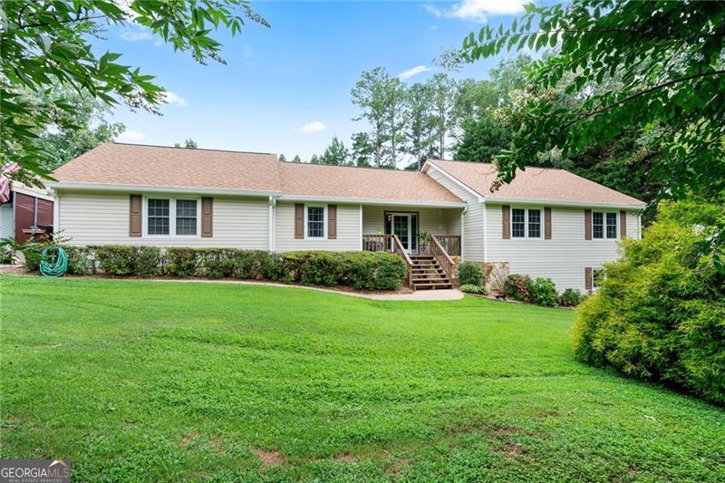 Beautiful ranch home on a private lot in the highly sought-after Denmark High School district-with NO HOA, no restrictions! This well-maintained property features a new roof (2023), a built-in hot tub, and backs up to 50 feet of undisturbed buffer, ensuring long-term privacy. The main level offers a desirable primary suite on main with a newly renovated bathroom, along with two spacious guest bedrooms and a full guest bath. The open-concept living room flows seamlessly into a generous kitchen equipped with custom pull-out cabinetry and soft-close drawers. Downstairs, the finished basement is an entertainer's dream, complete with a home theater area, expansive open space for games or gatherings, a fourth bedroom, and a half bath. Plumbing is already in place for a shower or tub, making it easy to convert into a full bath. Plus, a separate laundry hookup is ready for those wanting to create a true in-law suite. Enjoy energy efficiency with 18 double-hung, tilt-to-clean Low-E windows throughout the home. The oversized two-car garage includes built-in cabinetry, a workshop area, utility sink, and even a dedicated washer hookup for gardening or pet clean-up. Outside, you'll find a beautiful deck with a built-in hot tub that faces the spacious and landscaped backyard for ultimate relaxation. Also, boat storage, a 30 AMP RV hookup with covered storage, and a powered storage shed under the deck-perfect for tools or hobbies. Gardeners will love the plum and pear trees already thriving in the yard. This home has it all-space, functionality, privacy, and room for all your hobbies and toys!