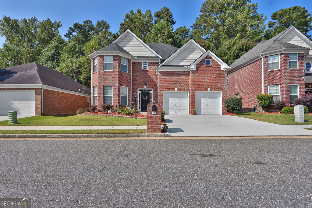 Welcome home to this meticulously maintained 4 sided brick, 4-bedroom, 2.5-bath home with a spacious layout. The main floor features a large open kitchen with beautiful wood cabinetry, a central island that opens to the breakfast area and living room with a cozy fireplace. There is also a separate dining area and an additional living room. Upstairs, the primary suite offers plenty of space with two walk-in closet and a private bath with a soaking tub and separate shower. Three additional bedrooms are generously sized, each also with walk-in closets, providing flexibility for guests, storage, or work-from-home setups. The roof was replaced less than 2 years ago. Buyers will enjoy the stone patio in the back to relax outdoors in an established community. Conveniently located near I-78, and I-85 and I-285, this home is just minutes from shopping, restaurants, and parks.