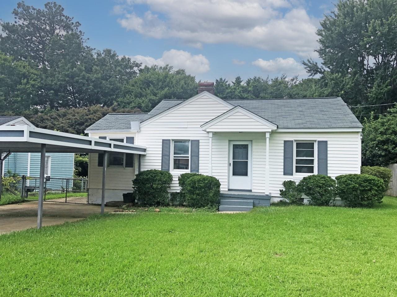 RENOVATED BUNGALOW NEAR THE MARIETTA SQUARE AND MAJOR ROADS; SPACIOUS HOUSE FEATURING AN OVERSIZED OWNER'S BEDROOM WITH NICE BATHROOM AND WALK-IN CLOSET; LIVING ROOM WITH BRICK FIREPLACE; OFFICE; TWO BEDROOMS WITH SHARED BATHROOM; KITCHEN HAS EATING AREA, LOTS OF CABINETS, NEW RANGE AND PANTRY; NEW PAINT THROUGHOUT; REFINISHED HARDWOOD FLOORS; NEW CARPET; COVERED DECK; LOTS OF PARKING - 2 CAR CARPORT, SINGLE GARAGE, AND PARKING PAD; ADDITIONAL OUTBUILDING FOR WORKSHOP; FENCED YARD.