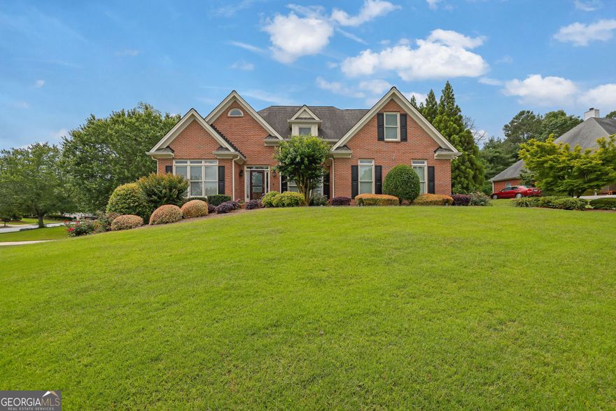 Stately 5-Bedroom Home in the Sought-After Grayson School District  Welcome to this elegant and spacious 5-bedroom, 4.5-bath home boasting over 3,700 square feet of thoughtfully designed living space. Nestled on a corner lot with a charming diagonal orientation, this property offers a warm "welcome home" feel the moment you arrive.  The main level features an oversized master suite with private access to a large, screened-in back deck-perfect for relaxing or entertaining. The deck is outfitted with durable LVP flooring, a ceiling fan, and a TV mount for year-round enjoyment. The fenced and landscaped backyard offers privacy and plenty of room to play or garden.  The heart of the home is a beautifully updated kitchen complete with granite countertops, tile backsplash, gas cooktop, double ovens, newer white cabinetry, and a walk-in pantry with direct access to the laundry room. Upstairs, you'll find three additional bedrooms and a unique catwalk-style hallway that enhances the home's open, airy feel.  The fully finished in-law basement suite offers incredible flexibility, complete with its own garage, generous storage, and both interior and private exterior entrances. Whether you need multigenerational living space or are looking for an income-producing opportunity, this versatile setup has you covered.  This home combines timeless charm with modern upgrades-don't miss your chance to own a truly unique property in a top-rated school district!