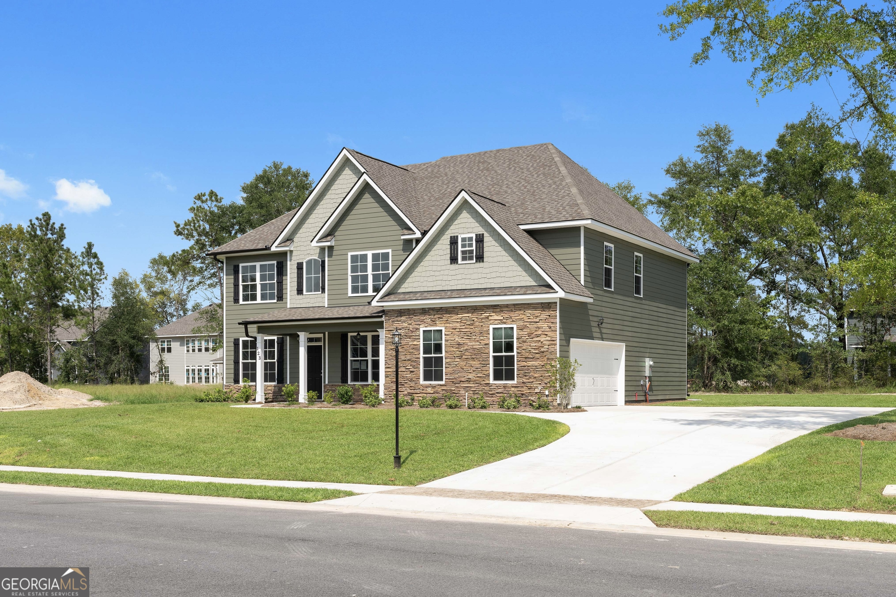 Welcome to Covered Bridge! A premier luxury community where timeless craftsmanship meets modern comfort. This stunning new Faircloth Homes residence showcases one of the builder's most sought-after floor plans, designed with both elegance and functionality in mind. The main level sets the tone with a formal dining room featuring a coffered ceiling, a private study ideal for work or quiet reflection, and a spacious great room centered around a cozy fireplace. Luxury vinyl plank flooring flows seamlessly throughout, leading to a guest or in-law suite complete with a full bath. At the heart of the home, the gourmet kitchen impresses with its oversized island, granite countertops, walk-in pantry, double oven, microwave, and ceramic cooktop-perfect for both everyday meals and grand entertaining. Upstairs, an expansive bonus room offers endless possibilities as a theater, playroom, or lounge. Four additional bedrooms include a deluxe owner's suite, thoughtfully designed with a private sitting area, spa-like bath with garden tub, walk-in shower, dual vanities, and a spacious walk-in closet. Completing this exceptional home are thoughtful touches such as a side-entry garage, irrigation system, and gutters, ensuring both beauty and convenience. With its refined details and prime location in Covered Bridge, this home is an unparalleled opportunity to experience elevated living. Don't miss out!