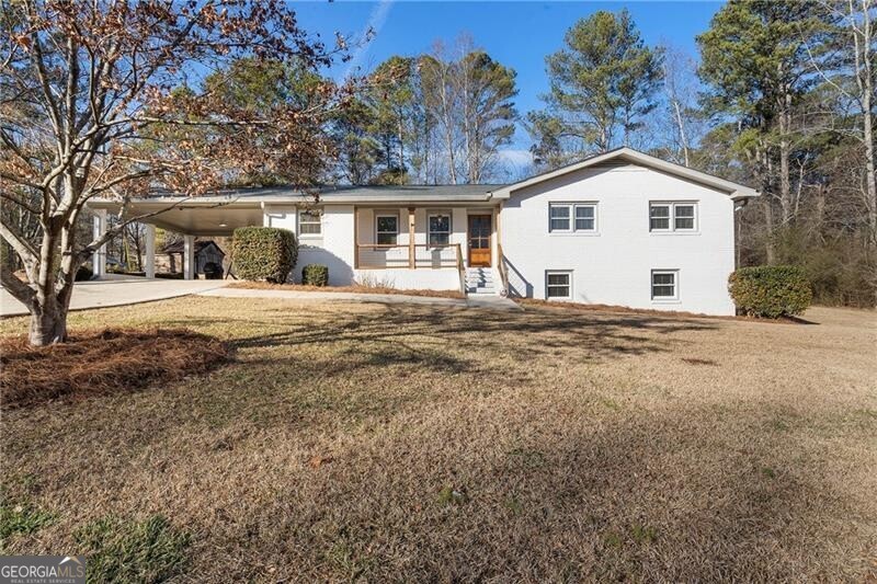 RENOVATED RANCH RETREAT Set on 1.3+/- acres of idyllic Milton countryside within the Birmingham Elementary, Hopewell Middle and Cambridge High School districts, this three-bedroom, two-bathroom home is a dream come true. Offering a rare balance of rural tranquility and refined living, the surrounding landscape inspires a sense of calm, with open green space framed by a canopy of trees drawing focus to the beautifully renovated white-painted brick ranch-style home at the center. The interior combines thoughtful design with everyday practicality. Shiplap accents carry a timeless charm throughout the living space, and plenty of thoughtful touches make daily routines effortless and enjoyable. The kitchen, with its polished granite countertops and white cabinets, is a bright and functional space for cooking, while a separate dining area offers an intimate setting for dinners and celebrations. The bedrooms provide serene retreats, and the finished terrace level (complete with a second kitchen) adds versatility and convenience. Use it to accommodate guests with a private living area, create a private in-law suite or design an entertainment hub. The second kitchen ensures easy meal prep without disrupting the main living rooms, and the entire layout of this level elevates the home into a space that can be tailored to a variety of lifestyles. Enjoy a yard wide-open for recreation that includes an outbuilding and a pool. A two-car carport, paired with additional parking, removes the stress of juggling limited spaces and offers protection from the elements, shielding vehicles while providing easy access to the home. Nestled within Georgia's horse country, this remarkable house invites a lifestyle of peace, privacy and outdoor adventure. Enjoy proximity to local farms and equestrian centers, tree services, gardens and recreation facilities. This home is convenient to Milton, Alpharetta and everything North Atlanta has to offer. Welcome to 2840 Mountain Road.