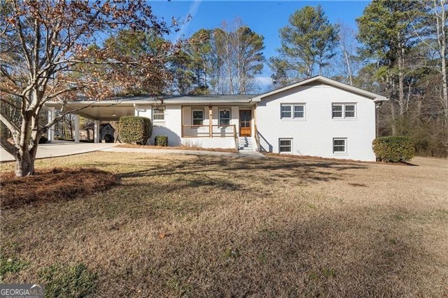 RENOVATED RANCH RETREAT  Set on 1.3+/- acres of idyllic Milton countryside within the Birmingham Elementary, Hopewell Middle and Cambridge High School districts, this three-bedroom, two-bathroom home is a dream come true. Offering a rare balance of rural tranquility and refined living, the surrounding landscape inspires a sense of calm, with open green space framed by a canopy of trees drawing focus to the beautifully renovated white-painted brick ranch-style home at the center.  The interior combines thoughtful design with everyday practicality. Shiplap accents carry a timeless charm throughout the living space, and plenty of thoughtful touches make daily routines effortless and enjoyable. The kitchen, with its polished granite countertops and white cabinets, is a bright and functional space for cooking, while a separate dining area offers an intimate setting for dinners and celebrations. The bedrooms provide serene retreats, and the finished terrace level (complete with a second kitchen) adds versatility and convenience. Use it to accommodate guests with a private living area, create a private in-law suite or design an entertainment hub. The second kitchen ensures easy meal prep without disrupting the main living rooms, and the entire layout of this level elevates the home into a space that can be tailored to a variety of lifestyles. Enjoy a yard wide-open for recreation that includes an outbuilding and a pool. A two-car carport, paired with additional parking, removes the stress of juggling limited spaces and offers protection from the elements, shielding vehicles while providing easy access to the home.  Nestled within Georgia's horse country, this remarkable house invites a lifestyle of peace, privacy and outdoor adventure. Enjoy proximity to local farms and equestrian centers, tree services, gardens and recreation facilities. This home is convenient to Milton, Alpharetta and everything North Atlanta has to offer. Welcome to 2840 Mountain Road.