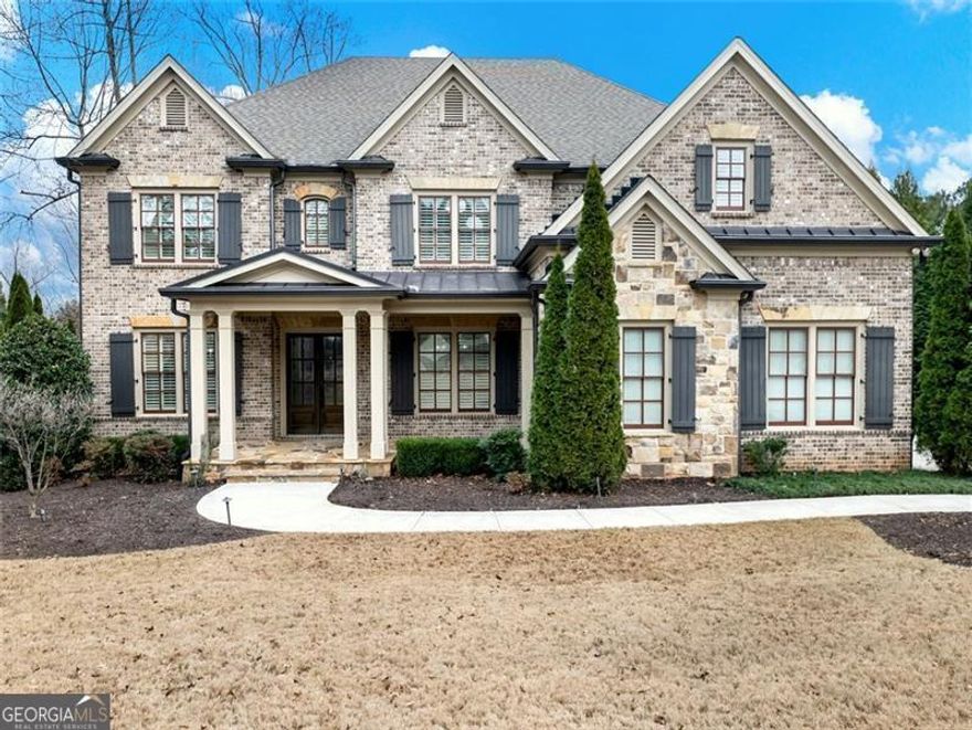 Executive home located in prestigious gated Sugarloaf Country Club. Newer built home than most homes in SCC and leveled cul-desac lot. Charming brick/stone,3 car-garage, 4bd/3ba Upper, 1bd/1.5ba on main, 1bd/1ba in basement. Plantation shutters throughout. Spacious kitchen opening to keeping room with fireplace, formal living room with fireplace, large dining room & Gentleman's study at front foyer. Finished basement w/fitness room, custom bar & wine cellar. Covered patio, screened porch, wooded pathway to 9th Tee Box. Close to TPC Sugarloaf Amenities. 27 Hole PGA level Golf Course. Easy Access to I-85.