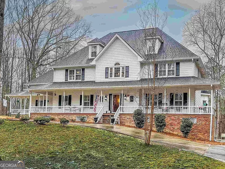 Welcome to the perfect blend of style and sophistication at this North Fayetteville estate, nestled on 4 private acres near Pinewood Studios. This home is designed for those who appreciate luxury, starting with its chef-inspired kitchen and complemented by a resort-style backyard with a lagoon-style pool, rock waterfall, and multi-level deck for entertaining. The heart of this home is the gourmet kitchen, a true showstopper. Renovated to perfection, it features Calacatta quartz counter tops, a five-burner gas cook top, double ovens, a built-in drawer microwave, and a custom coffee bar. Whether you're hosting a lavish dinner party or a cozy family breakfast, this kitchen is as functional as it is beautiful. Equally impressive is the primary suite, a private retreat that redefines luxury. Renovated in 2021, the spa-like bathroom is a masterpiece, boasting a freestanding soaking tub, an expansive walk-in shower, and skylights that bathe the space in natural light. The piece de resistance is the custom two-story walk-in closet, offering boutique-level storage with a built-in island, drawers, and a makeup station-a dream come true for any wardrobe enthusiast. The rest of the home is designed to impress, from the 20-foot ceilings in the great room with a stunning masonry fireplace to the open loft library overlooking the main living space. Upstairs, you'll find four additional bedrooms, all with walk-in closets, along with a newly renovated en-suite bathroom and Jack-and-Jill bathrooms. A partially finished basement adds endless potential for a media room, game room, or an entire apartment. This home delivers on every level-gourmet kitchen, luxury primary suite, and a backyard paradise-all wrapped in a timeless design. Schedule your private showing today and experience the exceptional lifestyle this estate has to offer.