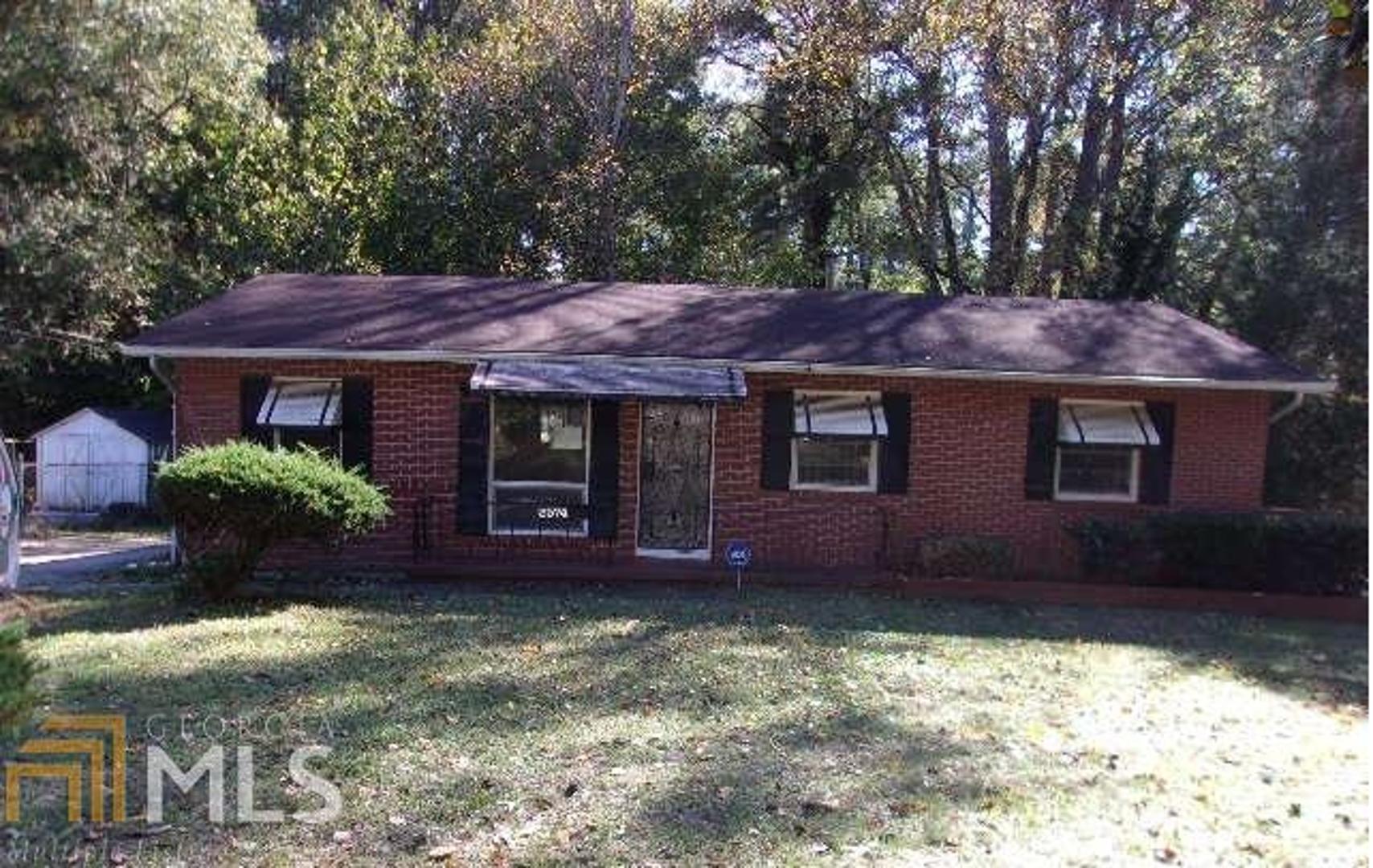 Four sided brick home with detached garage, separate dining, living and den. Nice front yard. HUD Owned Property. FHA Insurable with Escrow.