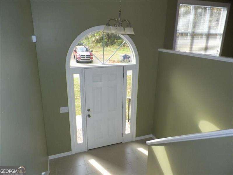 Available for immediate occupancy! Gorgeous 4 side brick home walking distance to downtown Acworth! Hardwoods and tile thru out, granite & stainless steel in kitchen, lg vaulted family room w/fireplace. Sep. dining & eat in area. Large master, mstr ba has garden tub, sep shower, double vanity. Could be 2nd master on lower level, lg bedroom,includes priv. bath & huge closet. Bonus/5th bedroom on lower level too! Oversized garage w/storage rm behind. Large deck & huge back yard. Near all conveniences yet tucked away just outside city of Acworth. Paint is agreeable gray presently.