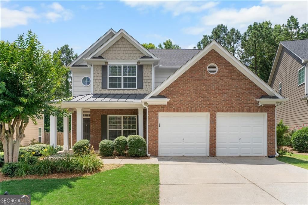 Welcome home to 435 Highlands Loop! This stunning home is situated within a gated, lake community in sought-after Woodstock with top-rated schools & resort-style amenities! Pull up to amazing curb appeal with brick & siding front & welcoming front porch! The interior is a thoughtfully designed open concept layout filled with natural light, calming tones, & stylish modern wood flooring! Family Room, Kitchen, & Eat-In flow to private backyard with huge covered patio & fenced-in yard-ideal for entertaining! The updated kitchen features white cabinetry, quartz countertops, new stainless steel appliances, & a large pantry! Laundry Room is located on main level, convenient to garage & half bath. Your spacious Owner's Suite was made to relax with heated tile floors in your bath, two separate walk-in closets, a remodeled spa-like shower, soaking tub, & double vanity with plenty of storage & counter space! One of the secondary bedrooms includes a cozy sitting or work area, perfect for today's lifestyle needs & views to the front yard while the other secondary has wooded views out back. Your backyard oasis is ready to finish out the Summer & welcome Fall-covered patio makes for a cozy feel & protects from the sun but you still have plenty of yard to play or plant! Enjoy a vibrant lifestyle with community pool, tennis, walking trails, and serene lake & mountain views! Owner's have filled this space with so much love & upgrades that set it apart including new AC unit, furnaces, covered patio, remodeled owner's shower & so much more! Upgrades list available in documents. This move-in-ready home that truly has it all-comfort, style, and location!