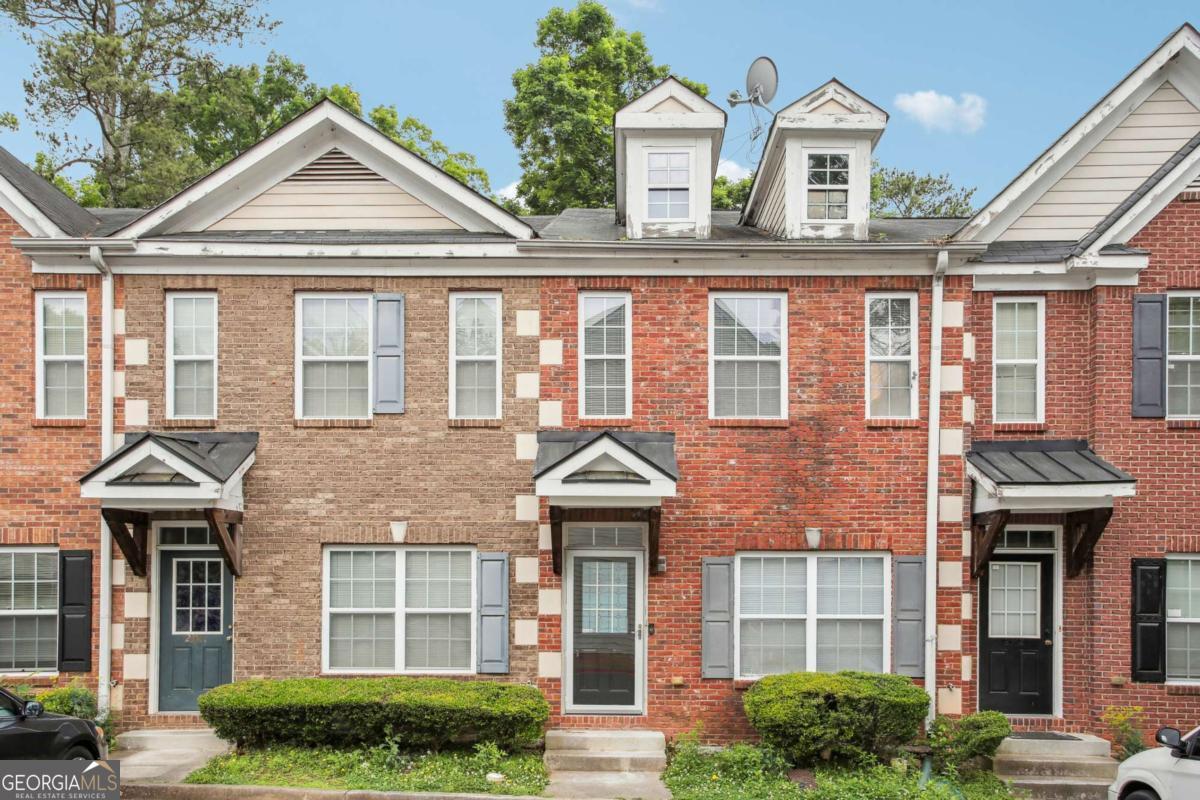 LOCATION IS EVERYTHING! This upgraded 3-bedroom, 3-bathroom townhouse offers unbeatable convenience just minutes from I-85/I-285, making for an easy commute to Emory, CDC, Buckhead, and Downtown. Step inside to a welcoming family room with a cozy gas log fireplace, a formal dining area, and a spacious kitchen featuring custom-built cabinets-perfect for entertaining. The main level also boasts a versatile bedroom or office with a full bath and access to a private deck, creating the perfect indoor-outdoor retreat. Upstairs, the expansive master suite impresses with a vaulted ceiling, walk-in closet, and spa-like master bath with double vanities and a garden tub. A third bedroom with its own private full bath completes this thoughtfully designed home. Don't miss this opportunity to own a stylish, move-in-ready townhouse in an unbeatable location!