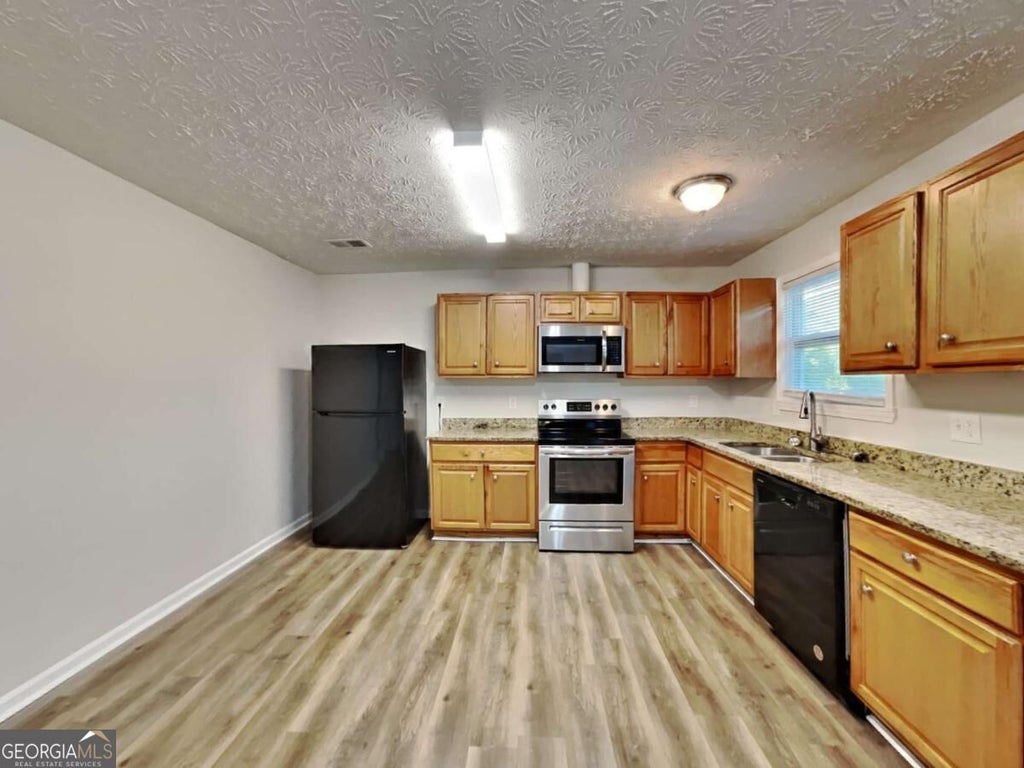 Photo of 7510 Elliot Way, Jonesboro, GA 30236 (MLS # 10852800)