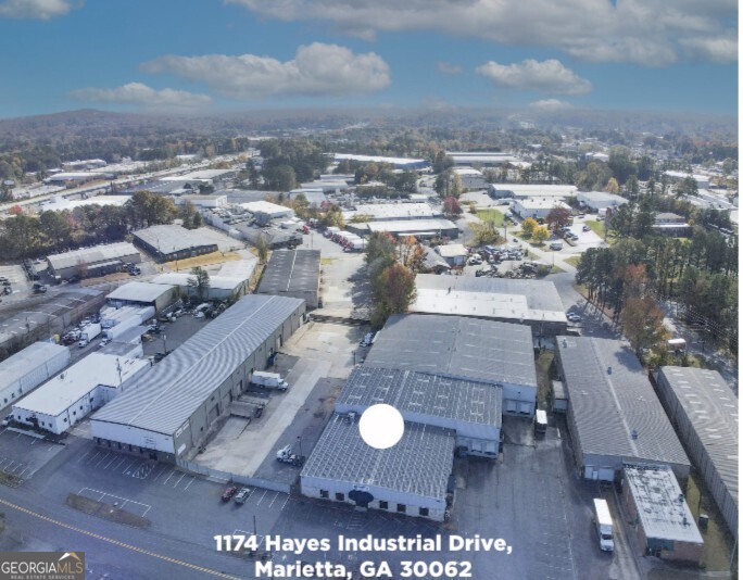 Presenting 1174 Hayes Industrial Drive, Marietta GA 30062: This B Class warehouse/office space with over 38,000sf on 1.47 acres is located less than half a mile from I-75 in Marietta and centrally located. Zoned Light Industrial with over 24,000 sf warehouse space including 5 loading docks with 3 high doors and 2 drive-indoors. Building height 25' with a clearance height of 24'. Office space includes a conference room, lobby, multiple private offices, ample space for team base layout, break rooms, and much more. Renovated upgrades include (4) 25-ton HVAC units installed in 2019 in the warehouse and (2) HVAC units installed in 2020 in the office area, along with 2000 amps @ 480. Near CSX rail lines and the Georgia Southern Railway Co, LLC for your logistics needs. Great opportunity for an investor or end user. HIGHLIGHTS: 38,240 SF includes 24,894 warehouse 13,346 office Four 25 ton HVAC units in the warehouse added 2019. Two HVAC units in the office new 2020. Sprinkler system throughout entire building/warehouse 5 Loading Docks - 3 high door / 2 drive-in Convenient access & ample parking.