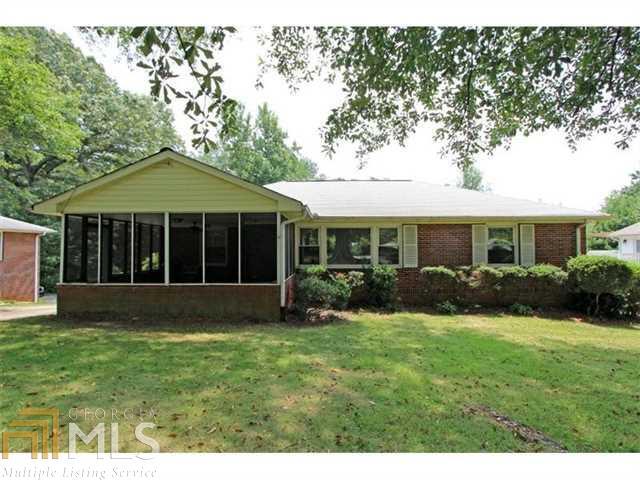 Solid, well maintained 4 sided brick ranch w partially finished basement, in the heart of Smyrna. Relaxing screened porch welcomes you to the front door. Refinished, gleaming original OAK HARDWOODS. Eat In Kitchen. Spacious owner's suite with it's own tiled, private bath. LEVEL,GREEN,PRIVATE BACKYARD offers a truly majestic setting. Total seclusion and privacy. 1 car garage with extra storage as well as a true WORSHOP W WORKBENCH. Endless possibilities and potential. Parking Pad with detached carport. Toolshed in back. Sought after Cheney Woods, walk to Village Green!