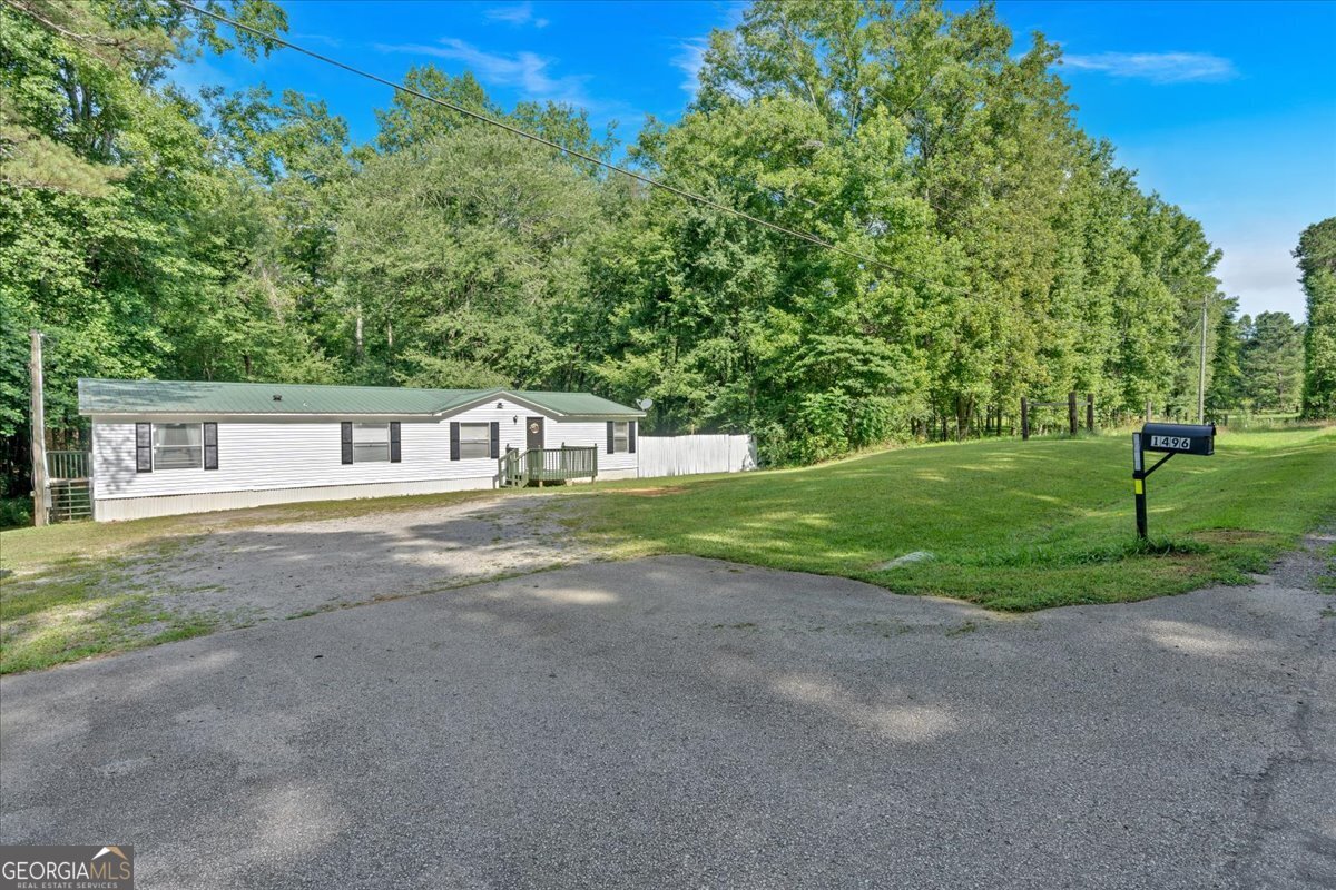 Welcome to peaceful country living with convenience! Nestled in Temple but located in sought-after Paulding County, this spacious 4 bedroom, 2 bath home sits on over 1.5 acres of open land-offering the privacy you want with the space you need. Inside, you'll love the updated kitchen cabinets, and a layout designed for comfortable living. The tiled master shower adds an updated touch to the primary suite, which also features a huge walk-in closet you'll have to see to believe. All appliances stay, making this move-in ready home even more appealing. Whether you're looking for your forever home or a quiet retreat with room to grow both inside the home and out, this property has it all. Don't miss your chance to own a slice of the countryside with easy access to everything Paulding County has to offer!