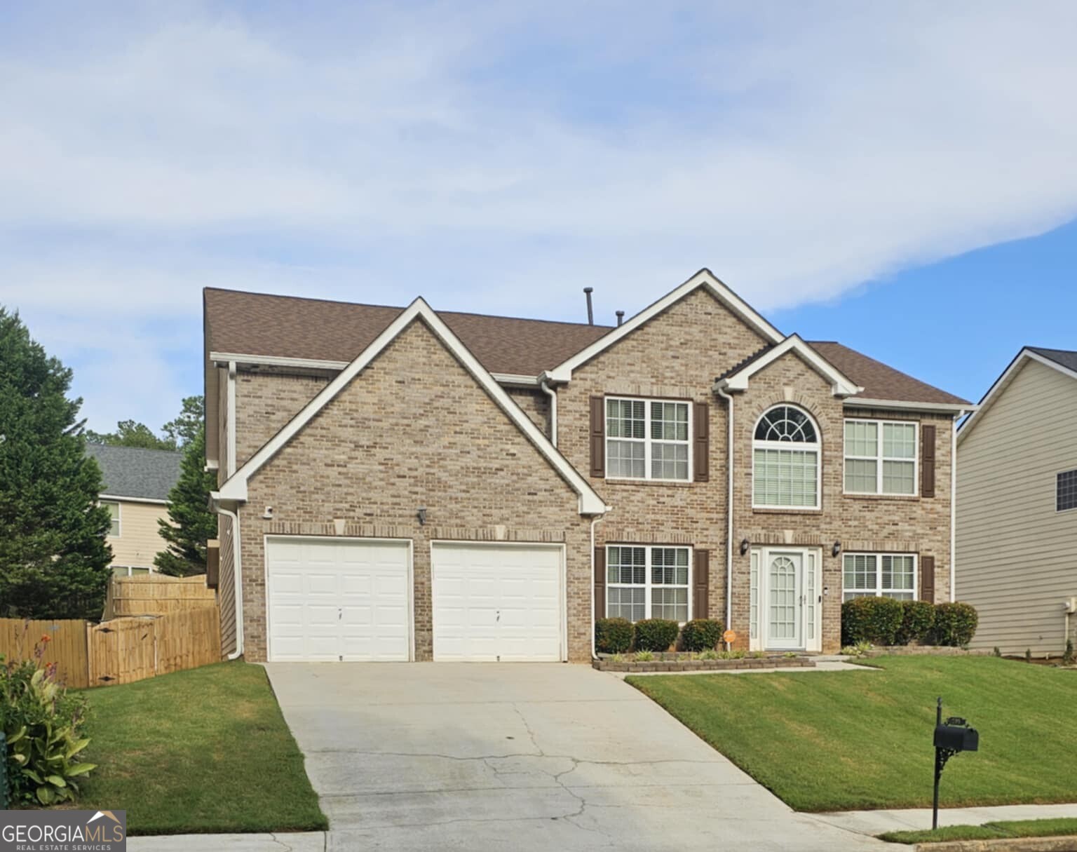 Welcome to this stunning 5-bedroom, 3-bathroom home in the heart of Fairburn - a rare gem offering space, style, and comfort. Thoughtfully designed and impeccably maintained, this home stands out with fresh paint throughout, and zero carpet for easy maintenance and modern appeal. The main level features a spacious bedroom and full bath, perfect for guests or multigenerational living. Upstairs, you'll find four additional bedrooms, including a luxurious master ensuite that truly sets this home apart. The oversized master retreat boasts a private sitting area with a cozy fireplace, a massive walk-in closet, and a spa-like bathroom that offers the perfect escape at the end of the day. Step outside to enjoy peaceful mornings and relaxing evenings on the screened-in back patio, ideal for year-round outdoor living. The home's fresh, neutral color palette and high-quality finishes make it move-in ready and easy to personalize. With its functional layout, multiple living options, and beautifully kept condition, this home offers a unique blend of elegance and practicality - all nestled in a quiet, well-established neighborhood in Fairburn. Don't miss the chance to make this exceptional property your own! This home is agent owned.