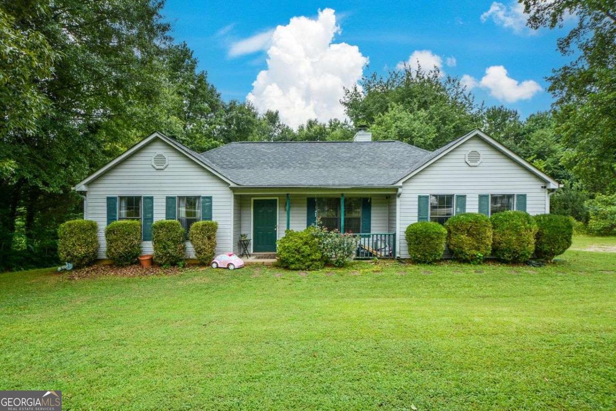 This ranch style home hosts 3 bedrooms and 2 full bathrooms. Perfect for a new family, or anyone looking for a home with ample potential to become a dream come true. This home has a warm feel to it as you walk into the house you step into a spacious living room where you can cozy up to the fireplace. Master on main with a spacious walk-in closet. The house sits on over half an acre leveled lot. Perfect for entertaining, gardening, games, and much more. There is a gas station conveniently located right before you get to the house. Just a few minutes away from downtown Historic Norcross where you can find stores, restaurants, and parks with many activities for everyone. These are some of the great amenities this home has to offer, so come and see for yourself the potential of what this home can be for you.