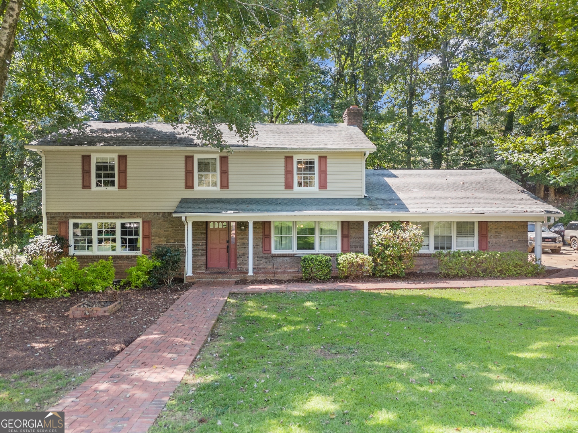 Traditional home in the heart of Gainesville that is close to the lake and has no HOA! This property is easy to access yet off the beaten path so there is not a lot of traffic to deal with. There is currently a make-shift 5th bedroom on the main level which is converted from a dining room. You could maintain it as a 5th bedroom or convert it back to its intended use. Cozy fireplace in the Great Room for evenings watching TV or just hanging out. Bathrooms are updated and roomy. Come check out this wonderfully located home and make it your own.