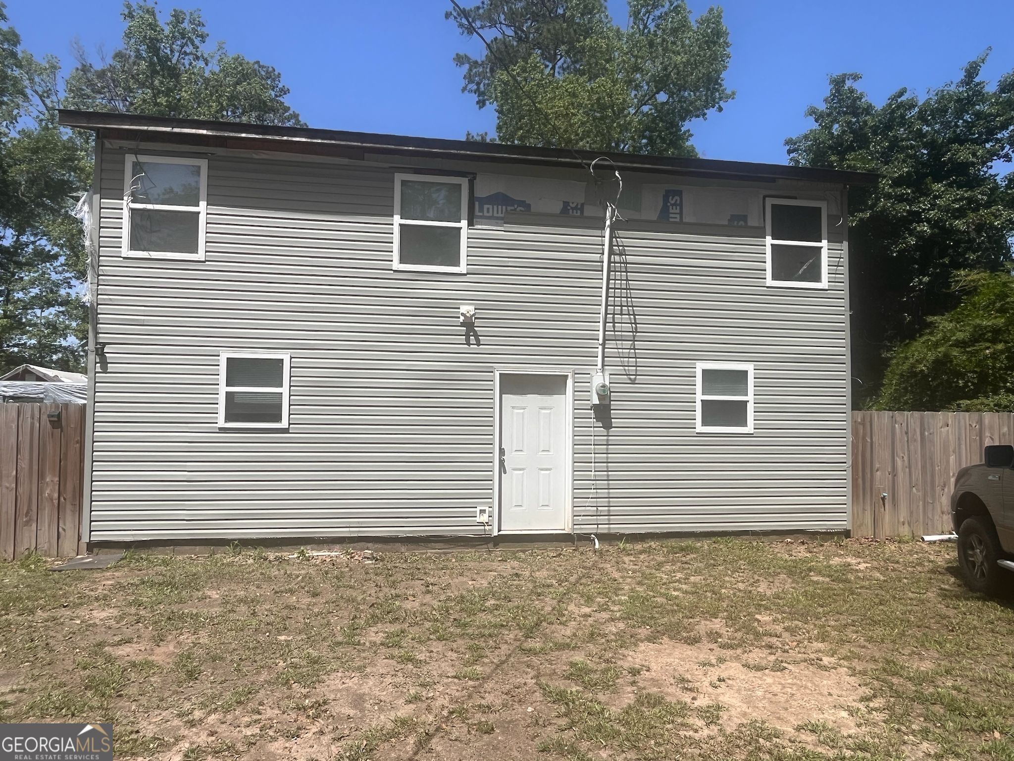 Waterfront home with private dock! This charming home boasts new windows, doors, and roof. A separate caretaker's cottage offers flexible living space. The interior features updated bathrooms and a new kitchen with fresh cabinets and counters, ready for your personal touch.
