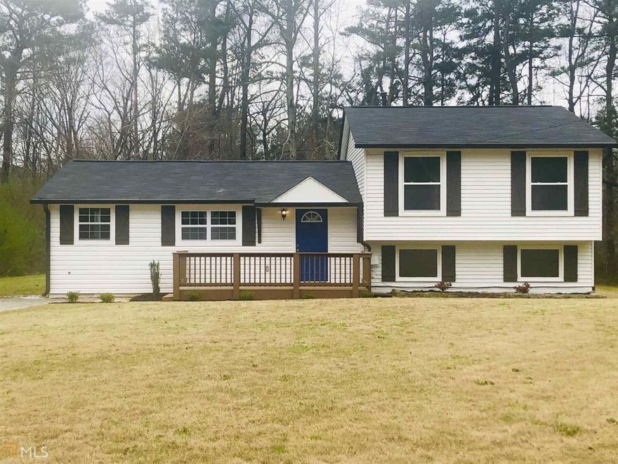 This house is a gem! Totally renovated: new roof, new hardwood floors, new colorful entrance door, a complete brand new kitchen featuring amazing white granite counter tops, stylish white cabinets, new appliances, new interior and exterior painting, remodeled and contemporary bathrooms, extra large level lot with lots of space for children and pets playing. Very good school district, excellent area! Don't miss this gorgeous property in Gwinnett area for this excellent price!!!