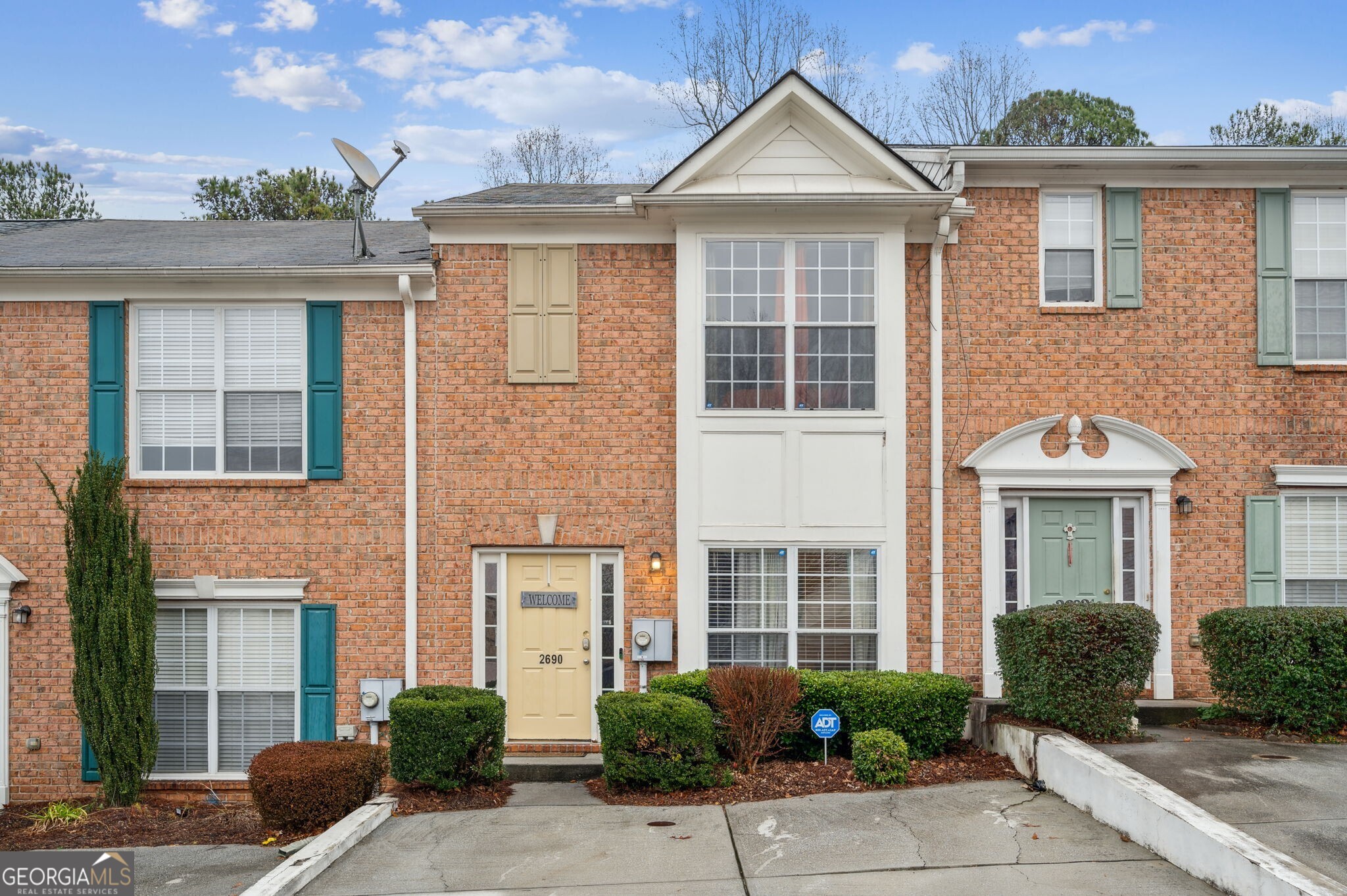 Beautifully updated 2-bedroom, 2.5-bath townhome offers the perfect roommate-friendly floorplan, with two full bathrooms upstairs and a convenient half bath on the main level. The spacious kitchen features white cabinetry, a large center island, and an eat-in dining area, all seamlessly open to the inviting living room ideal for entertaining or relaxing. Step outside to a private back deck overlooking a peaceful tree-lined view, providing a quiet escape from city life. Washer and dryer are included in the unit for added convenience. Located just off I-20 and only 20 minutes from downtown Atlanta, this home offers both comfort and accessibility. Tenant is responsible for utilities.