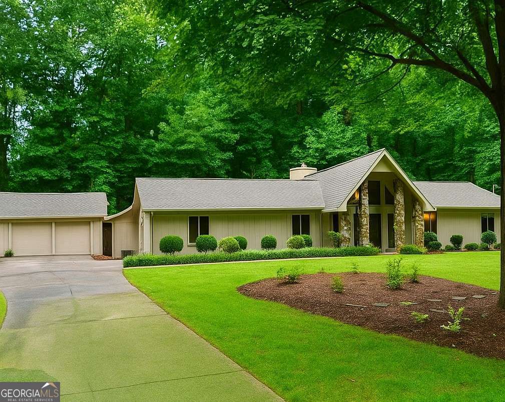 Prime Alpharetta Opportunity - Build or Renovate on .68 Acres! Don't miss this rare chance to own a level .68 acre lot in one of Alpharetta's most sought-after locations! Perfectly positioned just minutes from Downtown Alpharetta, Milton, major highways, premier parks, shopping, and award-winning dining, this property offers unmatched convenience and lifestyle. Currently zoned R15 with utilities available, the lot presents endless possibilities-whether you're a builder seeking your next project or a homeowner ready to design a custom dream residence. The existing home features a welcoming foyer entrance, formal living and dining rooms for gatherings, and a bright eat-in kitchen with white cabinetry, granite counters, and black appliances. A spacious family room with vaulted ceilings, fireplace, and abundant natural light creates the perfect central hub. The primary suite includes dual granite vanities, a tub/shower combo, and walk-in closets, while three additional bedrooms and two full baths provide ample space for family or guests. While the current home can be renovated, the true value lies in building new-a custom residence that maximizes this prime lot and unbeatable location. Bring your architect and designer to explore the possibilities. Opportunities like this are increasingly rare-review recent sales of lots and new construction nearby to fully appreciate the value this property offers.