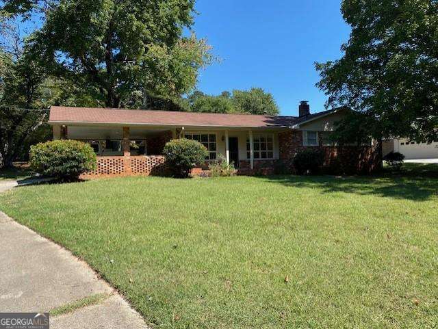 Adorable Brick Ranch Home Very close to Downtown Kennesaw! This home is so spacious and well maintained. Enjoy this Kitchen with so many Cabinets. Fresh Paint, Hardwood Flooring, Spacious Sun Room, Screened Porch, Partial Basement with Large Wood Burning Fireplace, Tons of Storage & A Large Front and Back Yard and all in walking distance to Downtown Kennesaw. What a joy to live in this awesome location. Walk downtown to eat dinner, Stand in line for ice cream or just to go shopping.