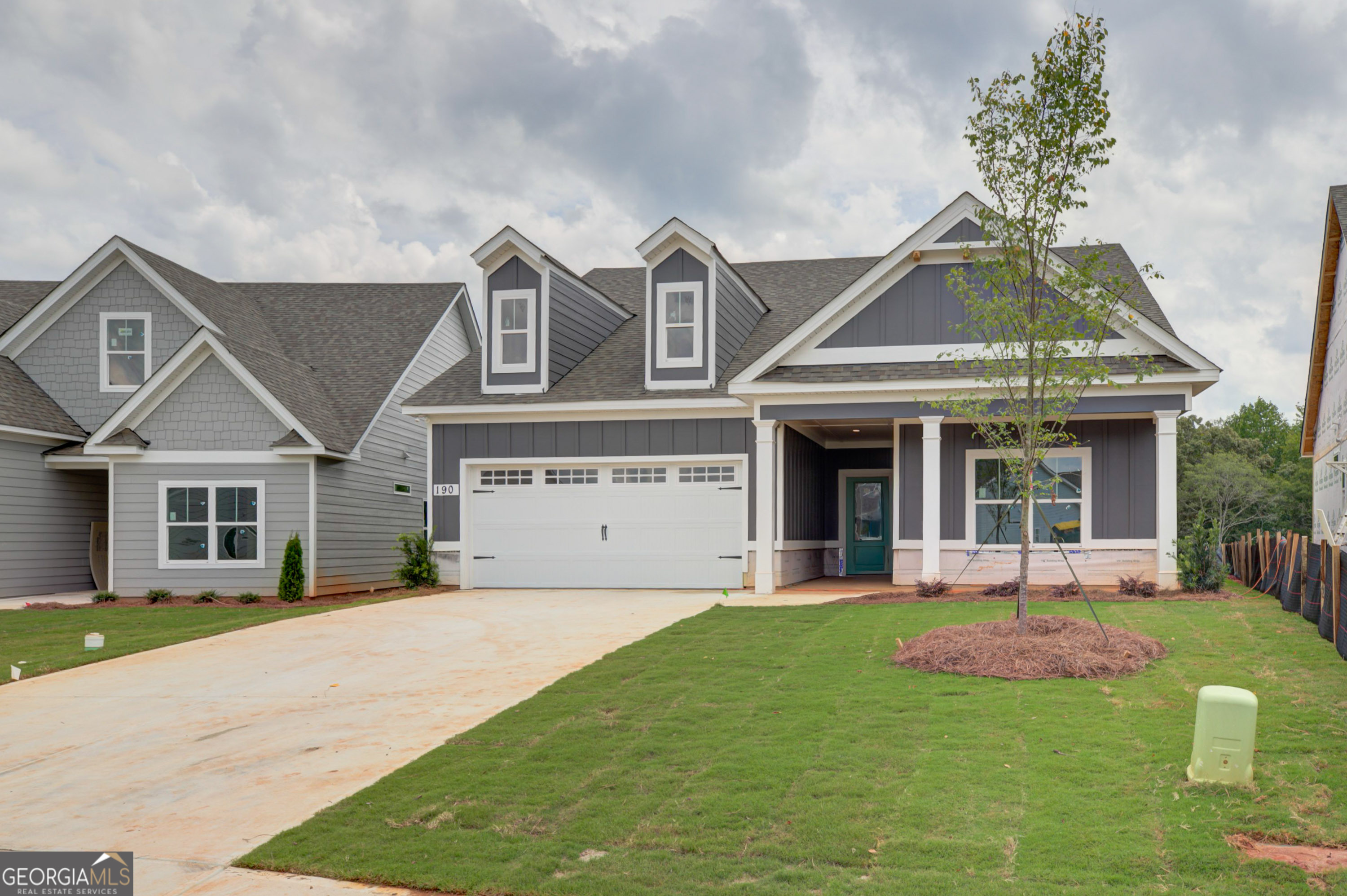 Chadwick Homes- New Construction. Largest floorplan with 4 bedrooms, 3 full baths, plus a loft. Gathering room with fireplace, vaulted ceiling. Bright open kitchen features upgraded herringbone tile backsplash, soft-close dovetailed cabinetry and gas cooktop. Main-level primary bed/bath with tiled shower, walk-in closet with custom built-in shelving. Laundry/mud room with designer tile. Two secondary bedrooms with shared bath also on main. Upstairs is a loft, plus fourth bedroom with full bath. Upgraded with no carpet! Spray foam attic insulation and tankless water heater. Two car garage + tandem golf cart garage! Covered front porch and covered patio. Lawn care included! Optional pool membership available. Enjoy all that downtown Senoia has to offer for shopping, restaurants, coffee shops, breweries, farmers market or strolling, just minutes away! Golf cart paths to Publix shopping center.