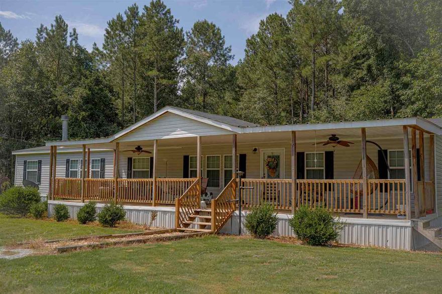 Here's your chance for 3.1 private acres outside of town in a great neighborhood. This home is incredibly spacious with 2 living rooms on opposite sides of the house. You basically have 2 Master Suites. You have to see it to believe it! The pics are great but seeing it in person is better. Call today for your private showing.