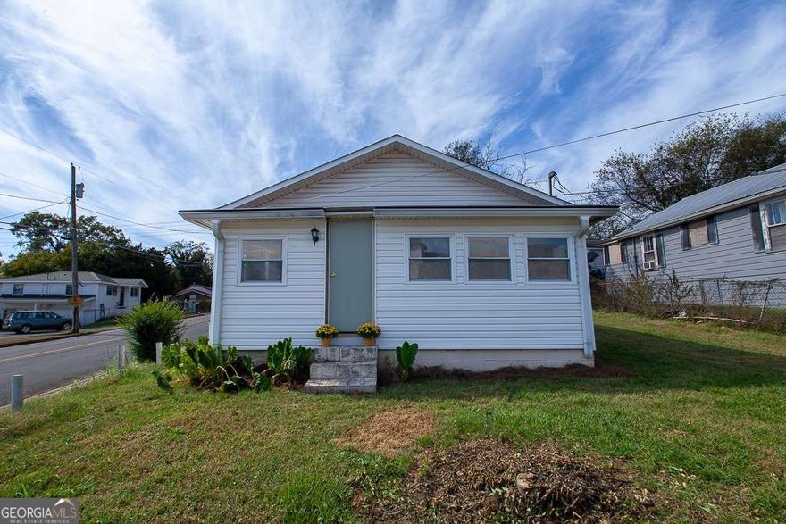 RANCH in the heart of downtown Calhoun! Walking distance to Calhoun Middle and High, as well as shops and restaurants! This quaint 2 bedrooms and 1 full bath home has all the big ticket items covered for many years of peace of mind. It has a new HVAC, new attic insulation, new gas water heater, brand new luxury vinal flooring throughout, fresh paint throughout, some upgraded lighting and plumbing, and double pane windows. The open concept kitchen and living room boasts sealed butcher block countertops, all new stainless steel appliances, freshly painted wood cabinets, large kitchen peninsula provides extra space for eating and gathering.  Finish out the 25x30 garage to create added living space or a workshop.  Will qualify for FHA after 12/15/2025.