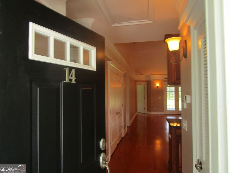 This well-appointed condo is located in the heart of Shellman Bluff. The 2 bed/2 bath home features a den that could function as a third bedroom,  large screened-in back porch overlooking the Sapelo Hammock Golf Course, hardwood floors, tiled bathrooms, full-sized stack washer/dryer, cathedral ceilings and a community pool. Enjoy all the amenities and restaurants Shellman Bluff has to offer including boating, fishing, golfing island beaches and a golf cart friendly community all just steps from your front door. Two assigned parking spaces, and HOA fees include pool, exterior maintenance, grounds maintenance, and water usage.