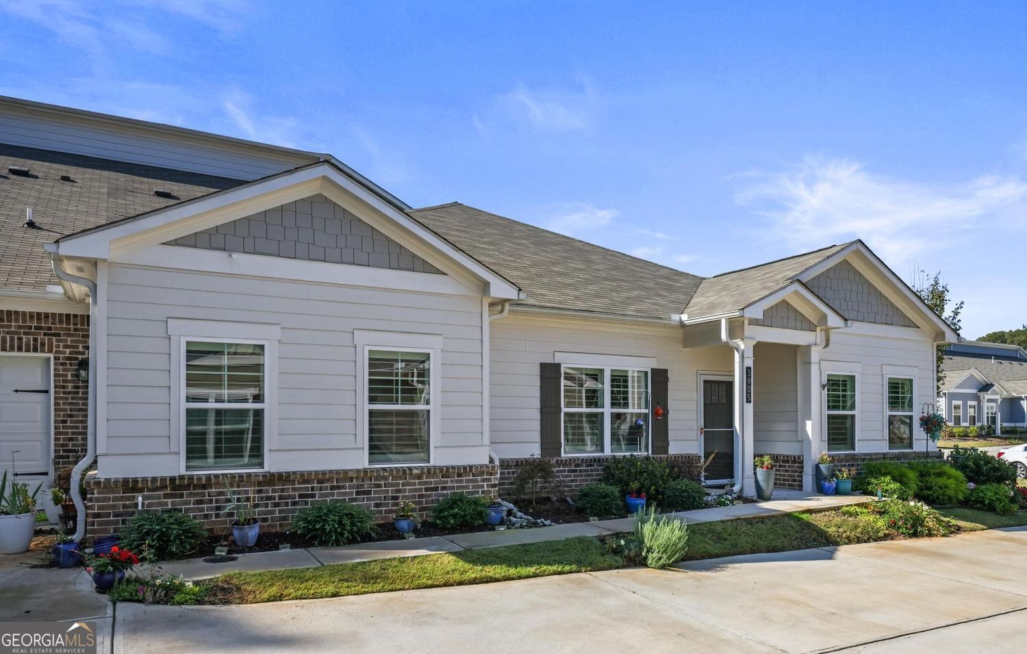 Welcome to this stunning 3-bedroom, 2-bath townhouse located in a highly desirable active adult community. This home is better than new with upgrades and features not offered by the builder, including all appliances, elegant 4" wood plantation shutters throughout, upgraded ceiling fans, and professional landscaping and SO much more. As you enter, you'll be greeted by a bright and open floor plan that flows effortlessly from the foyer to the eat-in kitchen. A large island with breakfast bar anchors the space, perfect for casual dining or entertaining, while the expansive living and dining areas provide plenty of room to gather. Step outside to enjoy the large screened-in covered porch, ideal for relaxing mornings or evenings with friends. The oversized primary suite offers a private retreat with a tray ceiling, double vanity, walk-in shower, and spacious walk-in closet This low-maintenance home is part of a vibrant active adult community and is conveniently located near shopping, dining, and everyday essentials. Combining comfort, style, and lifestyle, this move-in ready property truly has it all.