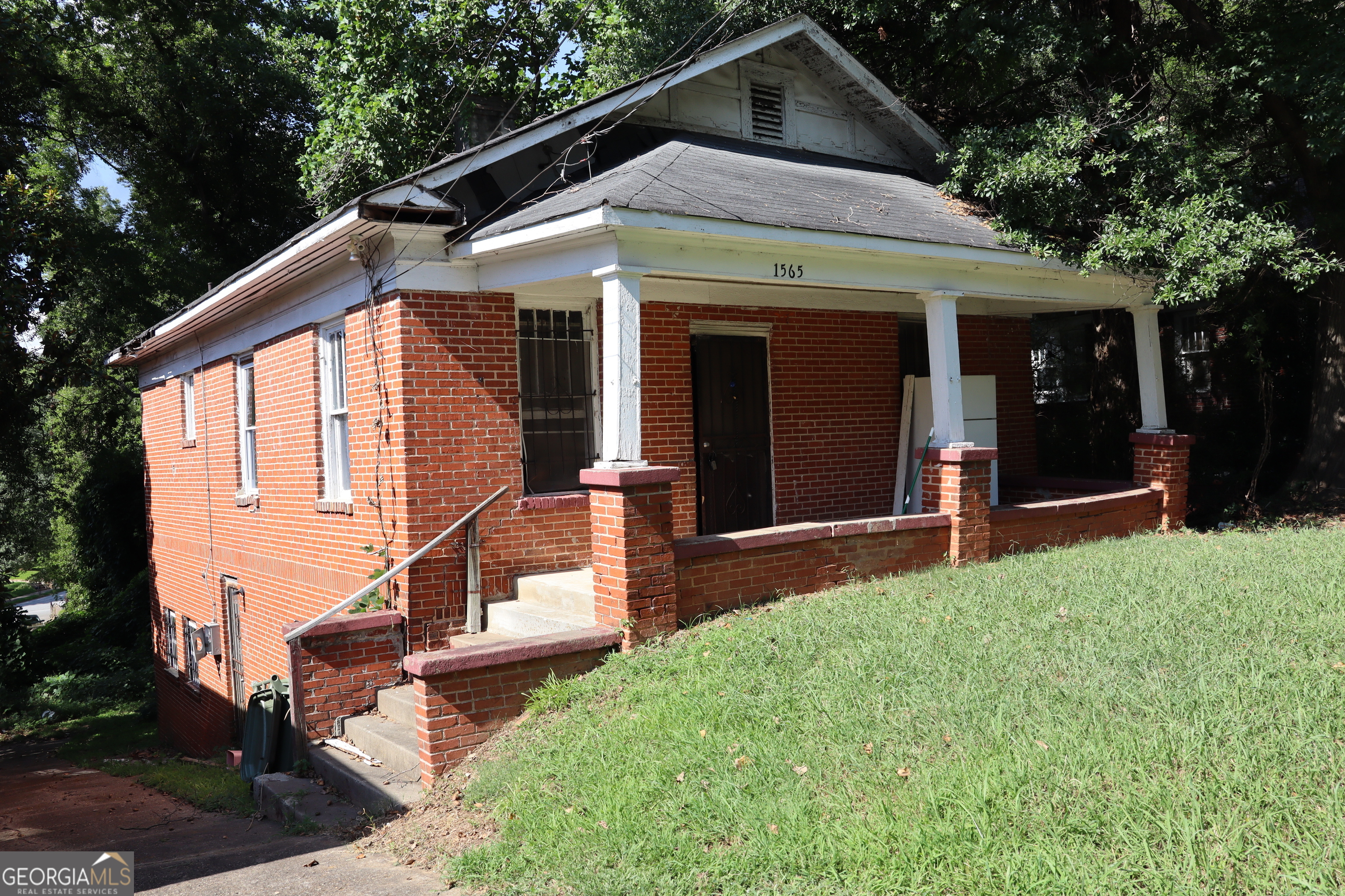 Welcome to this charming one-story brick home, perfect for a family looking to add their own personal touch and transform it into a modern-day gem. Nestled in a rapidly growing historic neighborhood surrounded by vibrant new developments, this area is buzzing with energy and opportunity. It's the kind of place you'll want to be - and stay. This home features 2 bedrooms and a bonus room that can easily be used as an office or converted into a spacious master suite by removing the adjoining wall. The expansive basement offers endless possibilities, envision a spa-like bathroom, home gym, movie theater, or entertainment area ideal for hosting guests or creating a private escape. Enjoy the oversized backyard, perfect for gatherings with family and friends. Add fencing for privacy and create your own personal oasis for fun and relaxation. Located just a bike ride away from the Westside BeltLine, you'll have easy access to walking and biking trails, public art installations, parks, restaurants, and shops. Plus, you're only minutes from Downtown and the airport convenience at its finest. This diamond in the rough won't last long. Don't miss your chance to make it your own! I've included interior and exterior animated walkthroughs to help you envision the possibilities after renovation. Picture yourself here - I can already see it. Can you? ________________________________________ Vacant. Home is sold as-is. My preferred lender, Mr. Konner Wright, can assist with a HomeStyle Renovation Loan - one of the most flexible low down payment options available. Want a timeless look and need a designer? I got you!