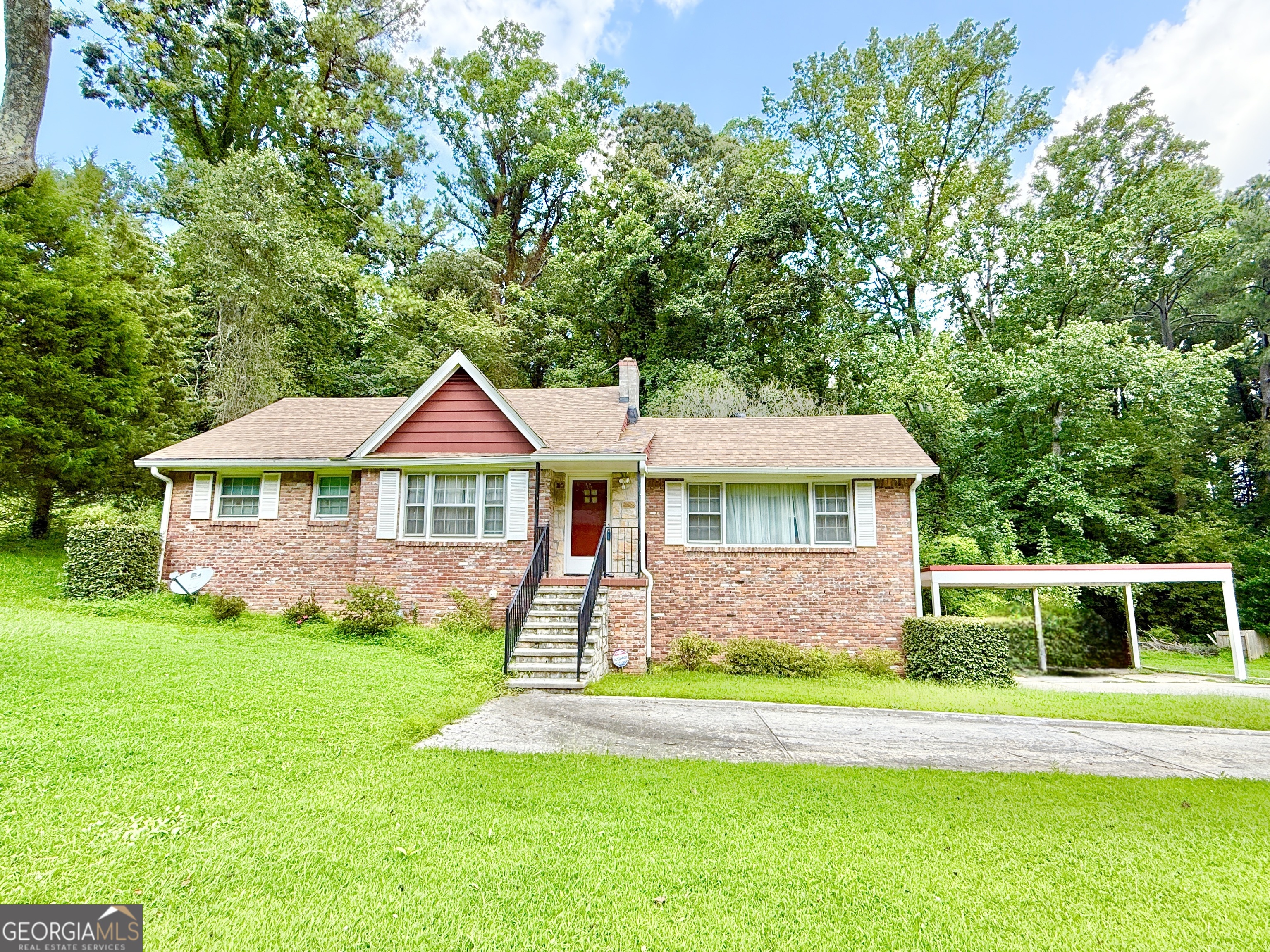 Located in the popular Conley Hills community of East Point. This home has great potential. Large 3 bedroom 2 bathroom home. Hardwood floors, spacious family room with fireplace. Large den off back of home. New roof (2024). Newer water heater (2022). Full unfinished basement with 1 car extra deep garage. Large private yard, appx .75 of an acre. This is a great deal for this low price! Tens of thousands below recent tax assessment value!