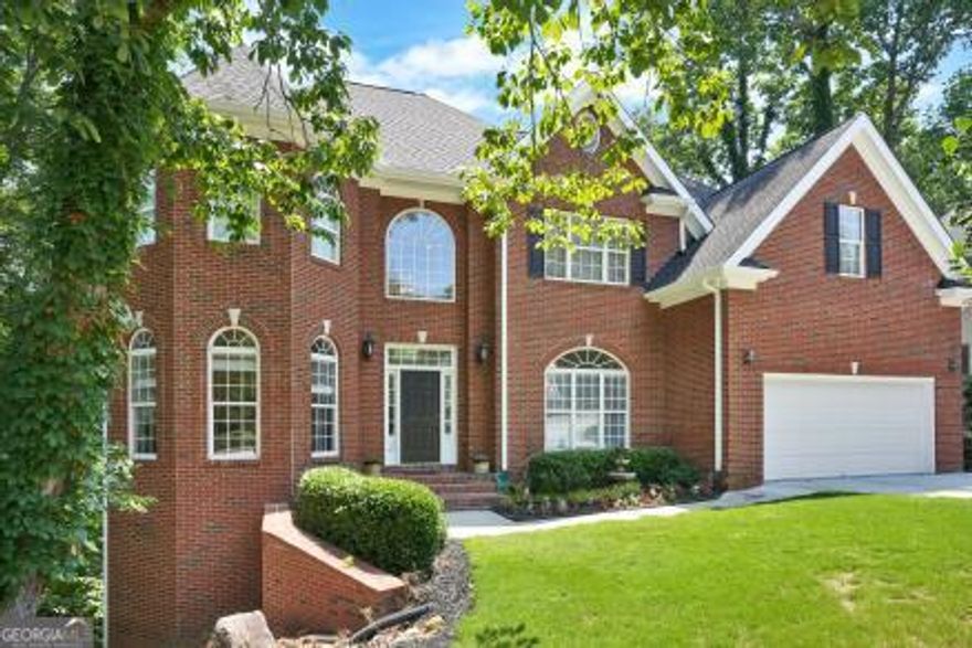 A gorgeous three story House you must see! This one of a kind, Move-in ready builder's home is located in Nesbit Lakes subdivision, The highly coveted swim and tennis community in Alpharetta, This three side brick house has three HVAC, Irrigation system and two water heaters 50-gallons each. The house is nestled in a peaceful cul-de-sac at the end of a quiet street bursting with natural beauty.   Home has eight Bedrooms with breathtaking views, five full bathrooms, and a fully finished daylight basement. The main floor features a bright open concept with tray ceilings, crown moldings and hardwood floors throughout, a two-story foyer, large dining room and formal living room, as well as an office with built-in bookcase and an attached full bathroom. The two-story great room has built-in bookcases, framing a marble gas fireplace. The bright open kitchen has beautiful stained cabinets, an island with built-in storage, pantry, granite countertops, double oven and a breakfast area opening to spacious outdoor deck. great for relaxation and entertaining friends and family.     The spacious Primary Suite on the second floor offers beautiful tray ceiling, a gas marble fireplace and large windows. Primary bath features-stained double Vanities, a separate shower, a large jacuzzi for two and a huge walk-in closet. The second floor includes three additional bedrooms and two full bathrooms.     The fully finished daylight basement has a separate entrance, a full kitchen with stained cabinets and granite countertops, large pantry, full bathroom, three additional bedrooms, an exercise room and a huge family room with tray ceilings and a third brick gas fireplace, all opening to a large deck overlooking a beautiful view of tree-lined view that offer complete privacy. An unfinished daylight sub-basement offers extra storage/hobby space. 2 car garage at kitchen level to park 2 cars.  Neighborhood amenities include a clubhouse, six tennis courts, swimming pool, splash park, playgrounds, grills, side walks, pickleball, two fire-pits and lake to enjoy fishing. This Neighborhood has it all!    The owner of the house is a real estate licencee under the law of Georgia.