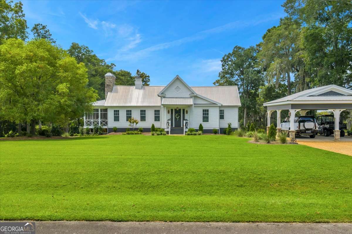 This is truly one of the most beautiful homes in the entire Lake Blackshear area! This five-bedroom, three full baths, three story home has everything. Large master bedroom on main floor, chef's dream kitchen with all new appliances, soaring ceilings in great room, fantastic double stone fireplace inside and outside on screened porch, exercise room, large deck overlooking lake and the feeling of total privacy. Many other recent upgrades. Lot has 152-foot seawall with great a dock with double boatlifts. You must come to see this property to realize how fantastic it truly is! Shown by appointment only!