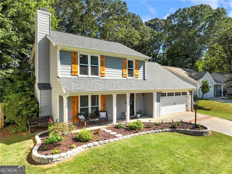 RENOVATED ON INTERIOR AND EXTERIOR! NO HOA! This John's Creek gem truly has it all. Kitchen was renovated in 2021 including new white shaker cabinets, quartz countertops, tile backsplash, and all new appliances. Master ensuite was also renovated in 2021 to include an oversized tiled and frameless shower and new vanity. Exterior was renovated in 2020 to include new roof, all new windows, and new siding. 2020 water heater. New shutters 2024. New flooring throughout main floor August 2025. Light fixtures have also been updated along with a drop zone area in 2024. This is a warm, cozy floorplan with a fireplace adorning the living area, flanked by built-in bookshelves. Dining room has views into kitchen and living areas for a seamless flow. Unwind on your back screened-in patio and enjoy your private, fenced yard. A cute shed can house your lawn equipment. New front yard landscaping 2025. Excellent schools! Walking distance to shopping and dining. Ten minutes to Avalon. Don't miss out!