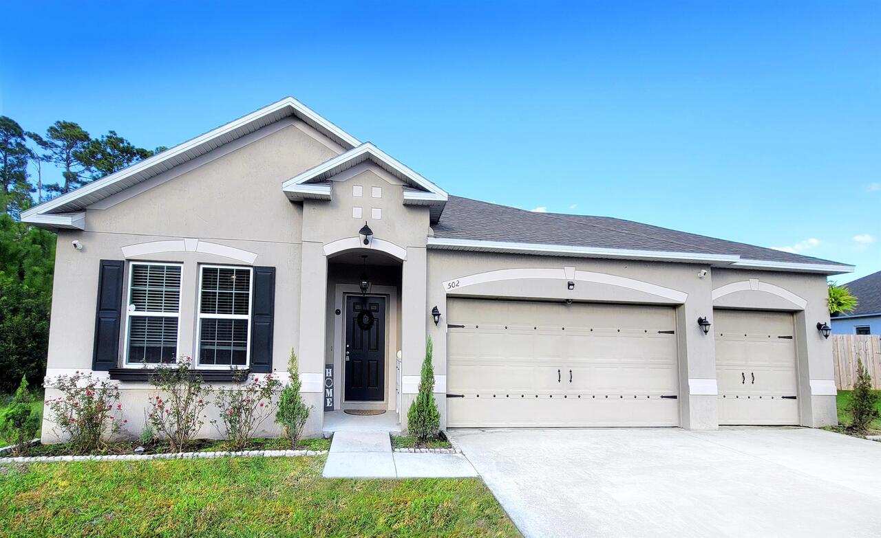 ATTENTION! ATTENTION! THIS IS THE "HOME SWEET HOME" YOU HAVE BEEN WAITING FOR! Are you looking for a home that was recently built in 2016? A home where the owners have remodeled almost EVERY room to create a warm space with farmhouse and rustic appeal? A home that has a bonus room AND an additional flex space? A home that has a 3 CAR GARAGE? A home that has a MASSIVE backyard with freshly poured concrete to park your toys or build a massive storage space or craft shed? Then, this is the home for YOU! Why build when you could move right into this pristine home! This 3 bed/2 bath home (with bonus room AND additional flex space) is nestled in the desirable Lake Victoria Subdivision and located at the end of a cul-de-sac. Walk in to experience the NEW CUSTOM BUILT FARM HOUSE ENTRY WAY / FOYER SPACE with built in wood seating (that can be removed), NEW decorative tile flooring, NEW lighting, and luxurious wood ceiling! Near the entry way is a bonus room that can be used as an office space, guest space, library, or whatever your heart desires! The spacious kitchen features DOUBLE stainless steel ovens, plenty of storage within your UPDATED white cabinetry, NEW (tastefully done!) subway backsplash, NEW pendant lighting, NEW granite countertops, and a NEWLY built wood grain breakfast bar with decorative tiles that accent it perfectly! This home features an open floor plan that flows right into the large family room. NEW wood-look laminate flooring has been installed throughout the main living areas and soft carpet in the bedrooms. The split bedroom layout is perfect for families, and also includes a flex space between the two guest bedrooms that can be used as a play room, game room, craft space, etc.! The master and guest bathrooms have NEWLY UPDATED vanities/faucets, NEW rustic mirrors, UPDATED white cabinetry, and NEW decorative tile flooring in the guest bath. The laundry room also has NEW CUSTOM BUILT WOOD shelving! This home is beautifully landscaped and the .44 acre lot offers tons of privacy and includes a gorgeous screened in lanai. Close to base, shopping, restaurants and I-95. You don't want to miss this one! Schedule your tour today!