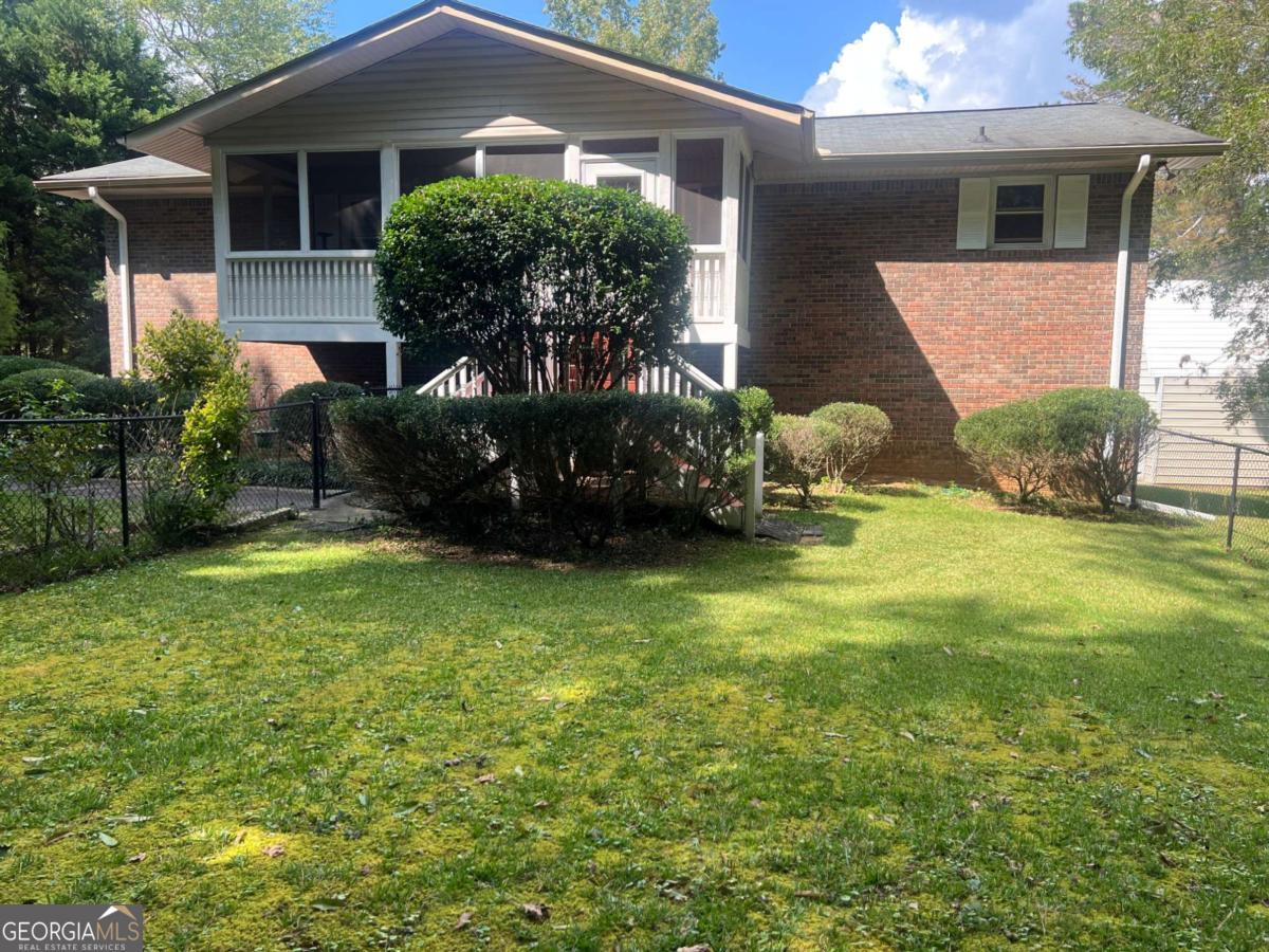 You'll love the unique design in this brick home with a 3 car detached garage with studio. One level with screened porch entry. Finished basement has amazing space and opportunity for separate living quarters. Owner is an artist and enjoys the finished basement with an art studio , craft/hobby/office space , two bedrooms , small kitchen area and full bath. Long private drive way with gazebo as you enter, tucks this home back from the road with privacy. The 1.46 acre lot provides space for above ground pool and access to a small lake ideal for kayaking or fishing. This a perfect home for someone who needs a home that accommodates many needs. Professional pictures coming soon.